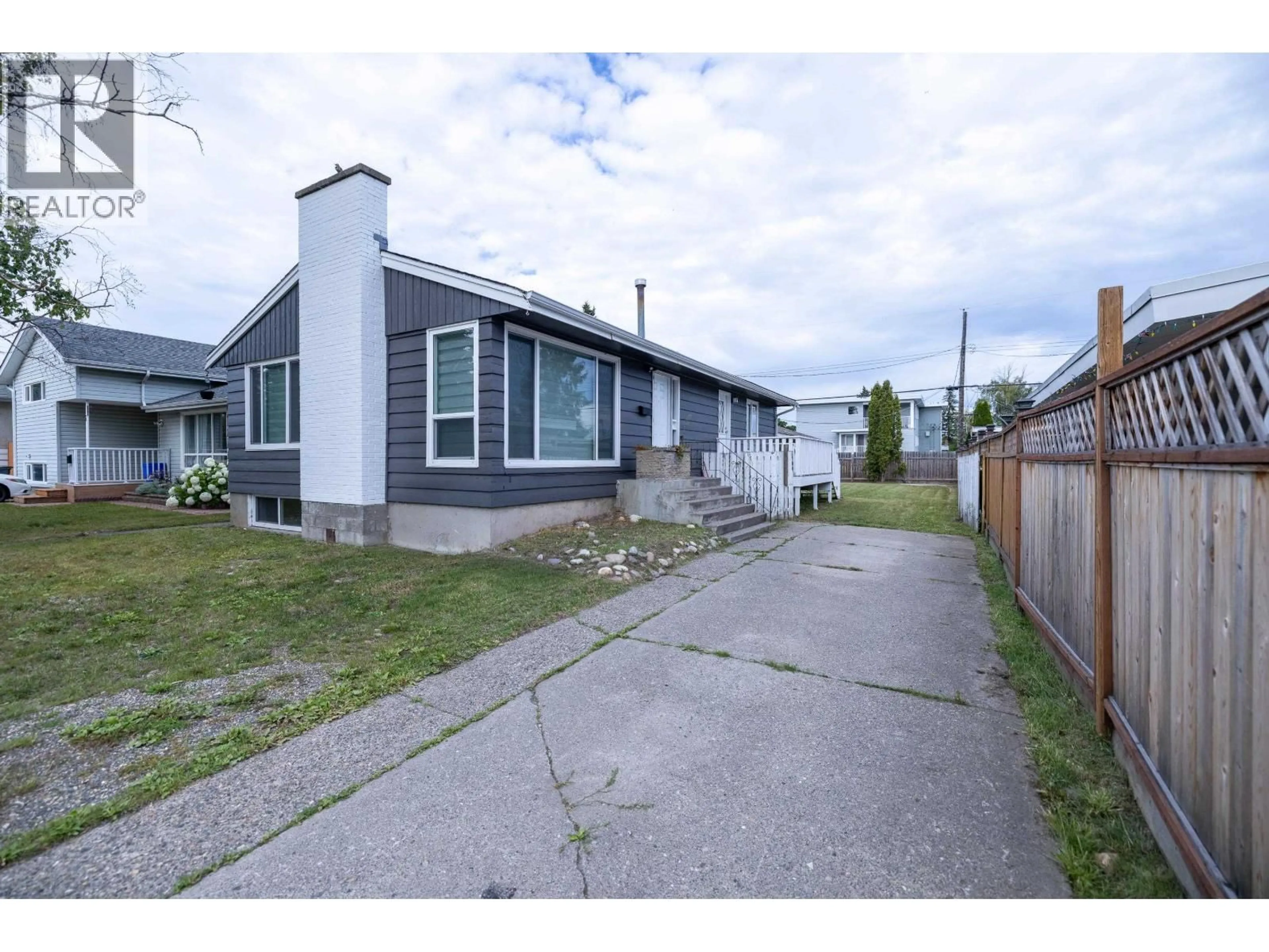 A pic from outside/outdoor area/front of a property/back of a property/a pic from drone, street for 242 LYON STREET, Prince George British Columbia V2M3K8