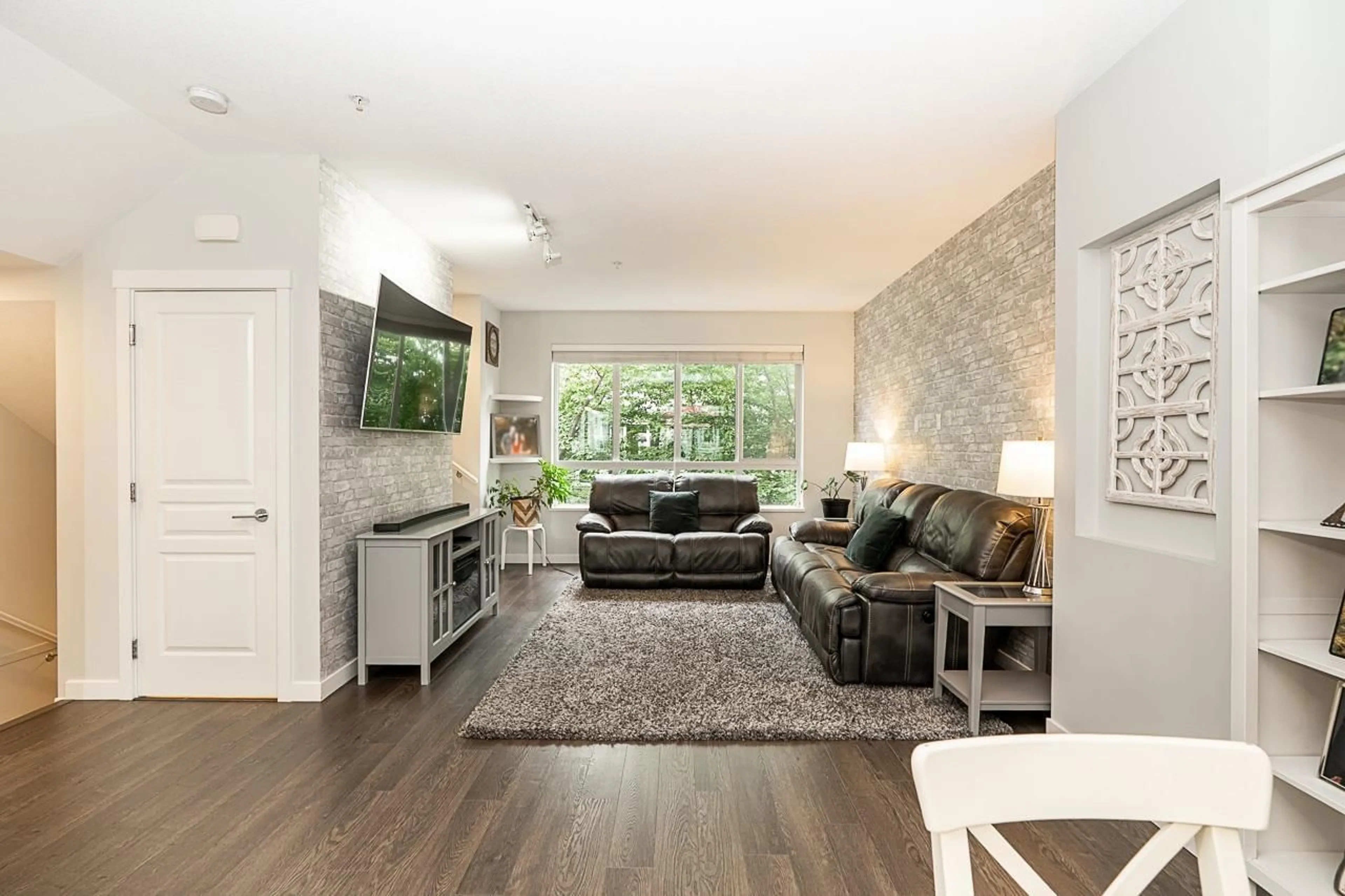 Living room with furniture, wood/laminate floor for 129 - 8138 204 STREET, Langley British Columbia V2Y0T4