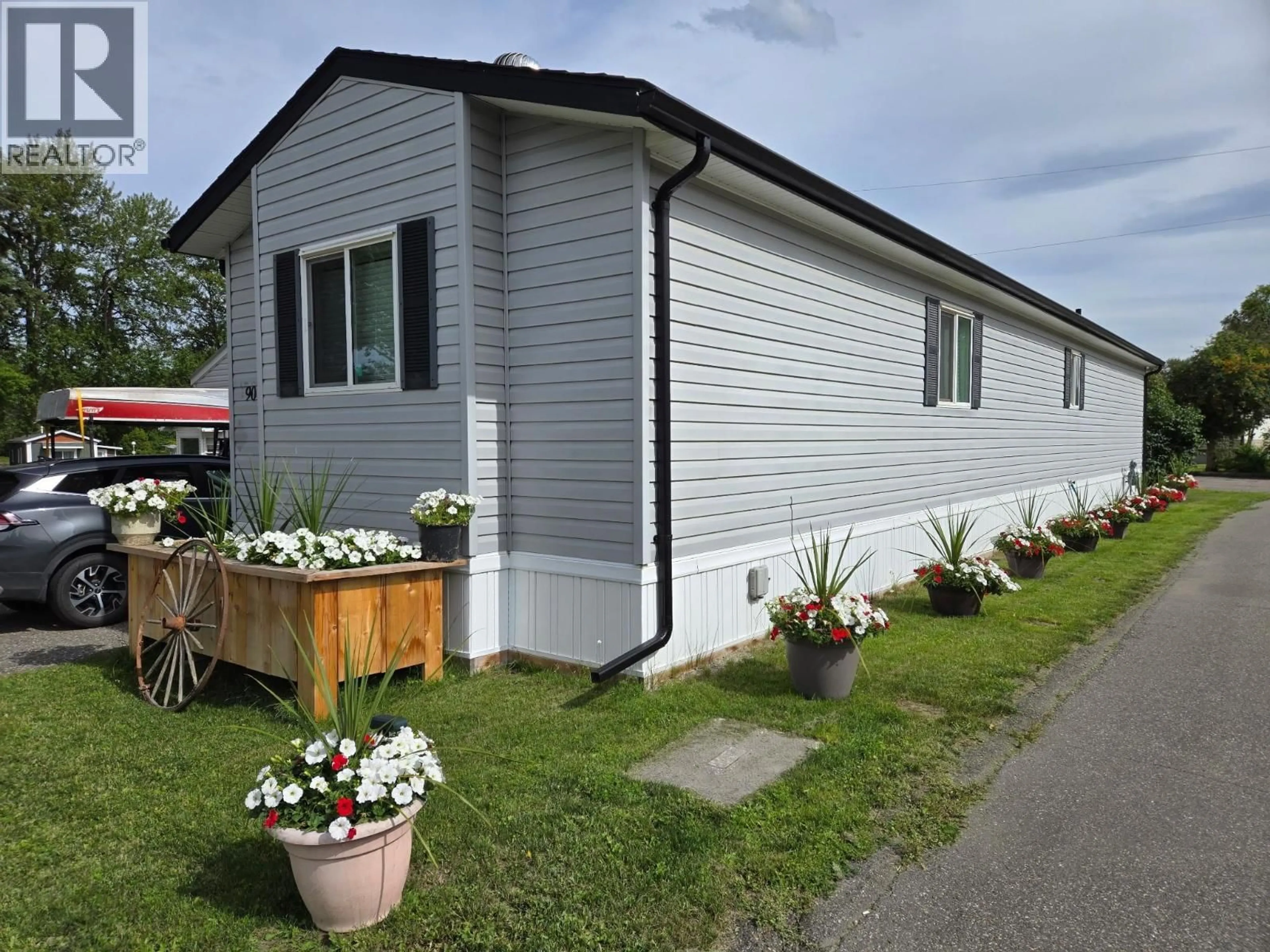 Home with vinyl exterior material, street for 90 - 684 NORTH FRASER DRIVE, Quesnel British Columbia V2J1Z6