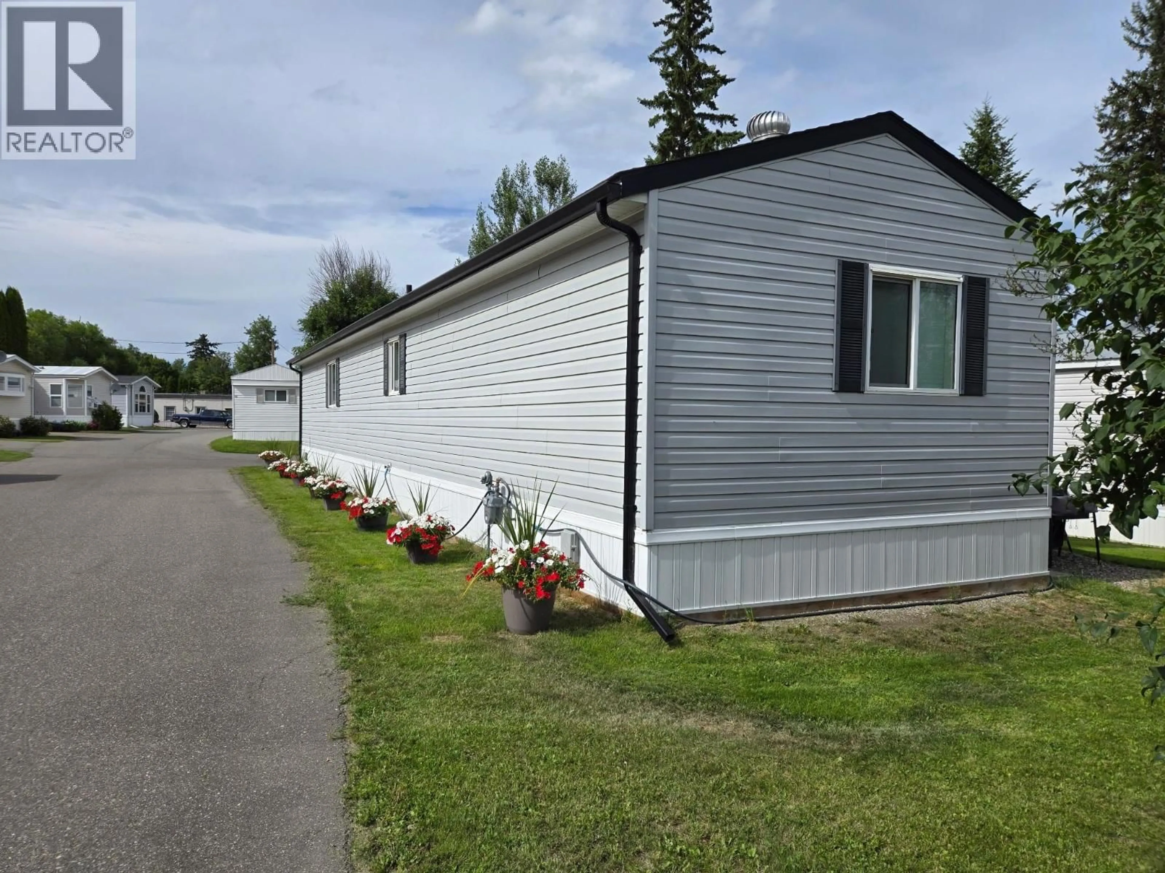 Home with vinyl exterior material, street for 90 - 684 NORTH FRASER DRIVE, Quesnel British Columbia V2J1Z6