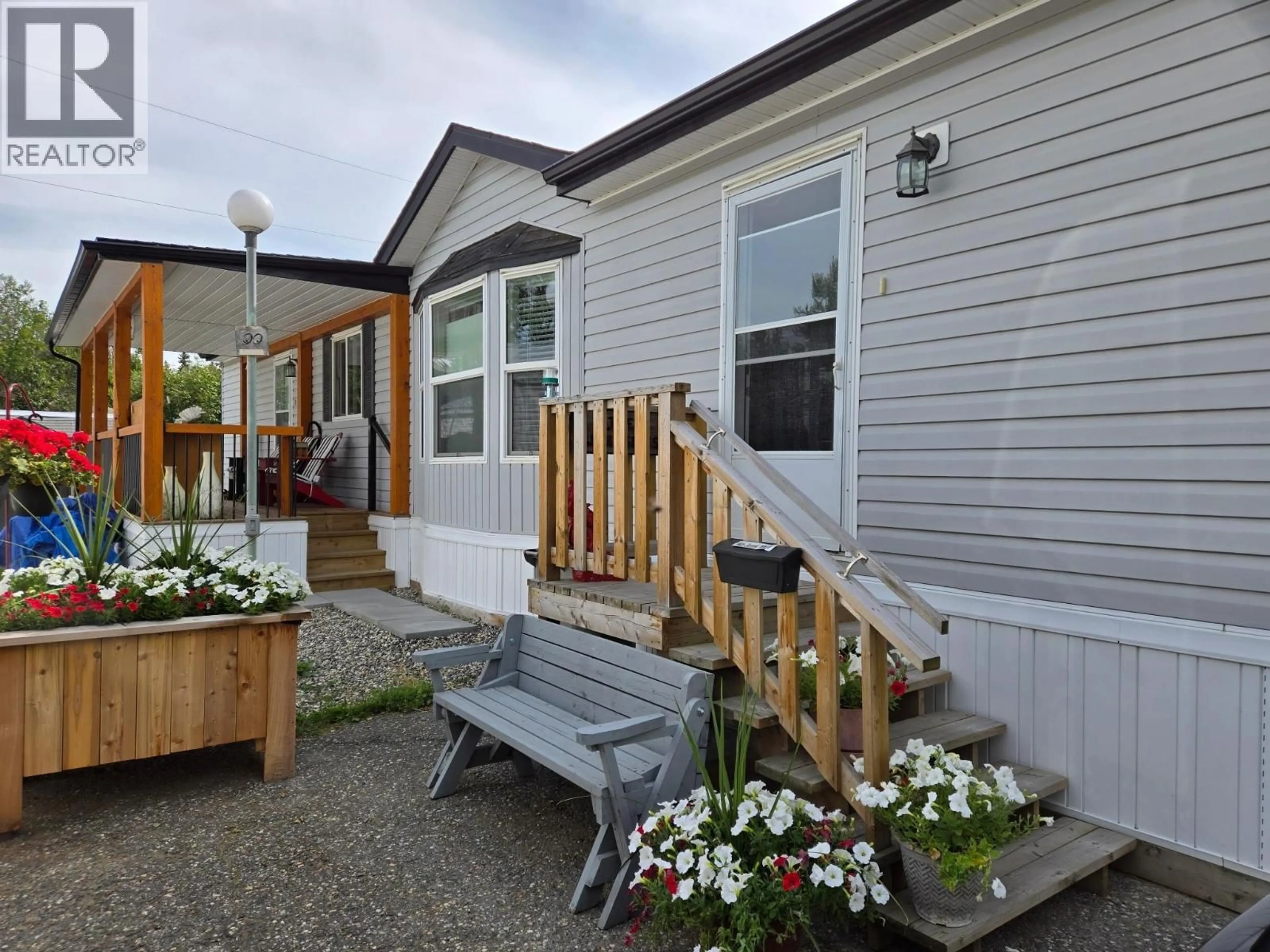 Home with vinyl exterior material, street for 90 - 684 NORTH FRASER DRIVE, Quesnel British Columbia V2J1Z6