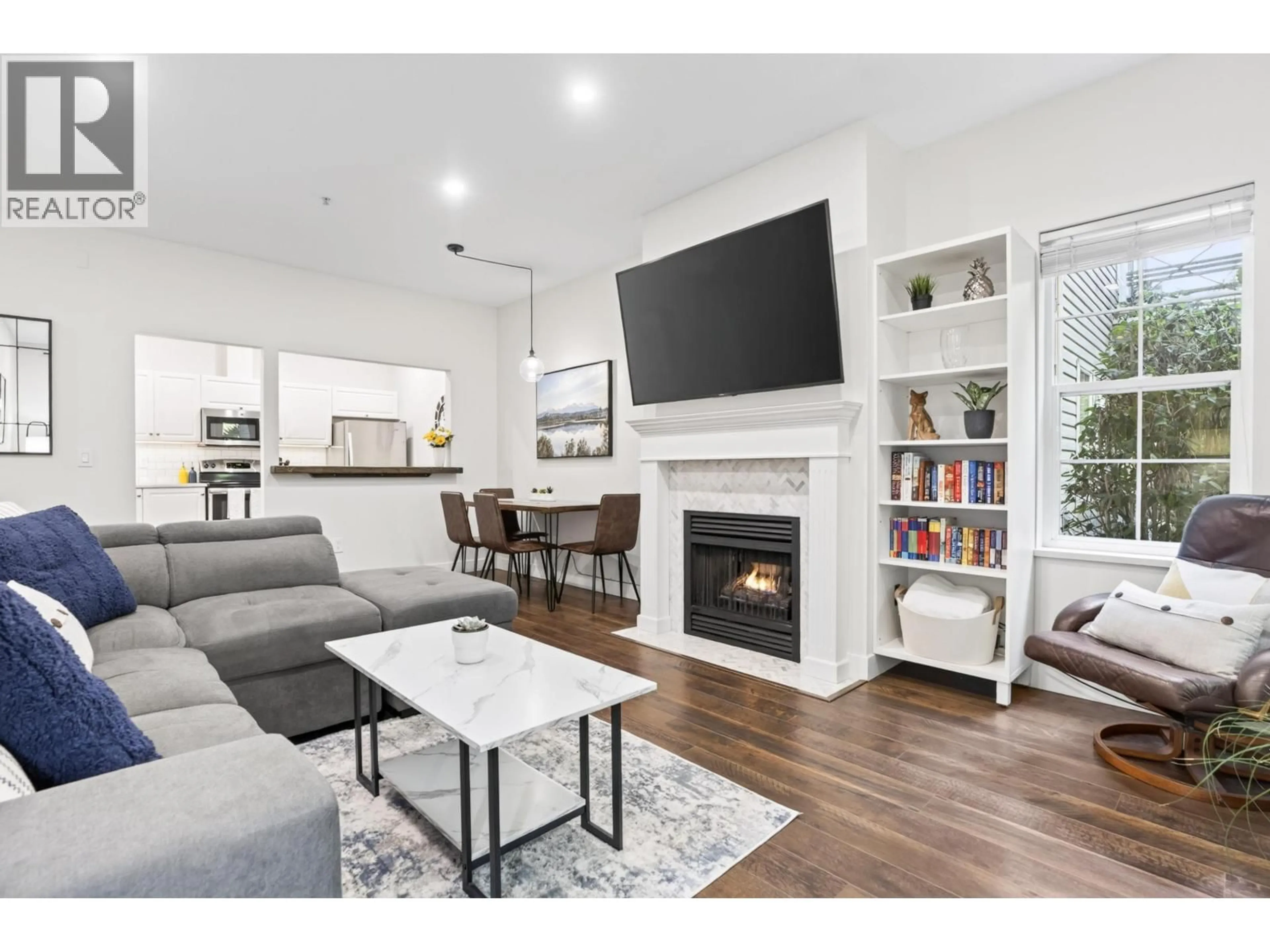 Living room with furniture, wood/laminate floor for 106 - 4745 54A STREET, Delta British Columbia V4K2Z9