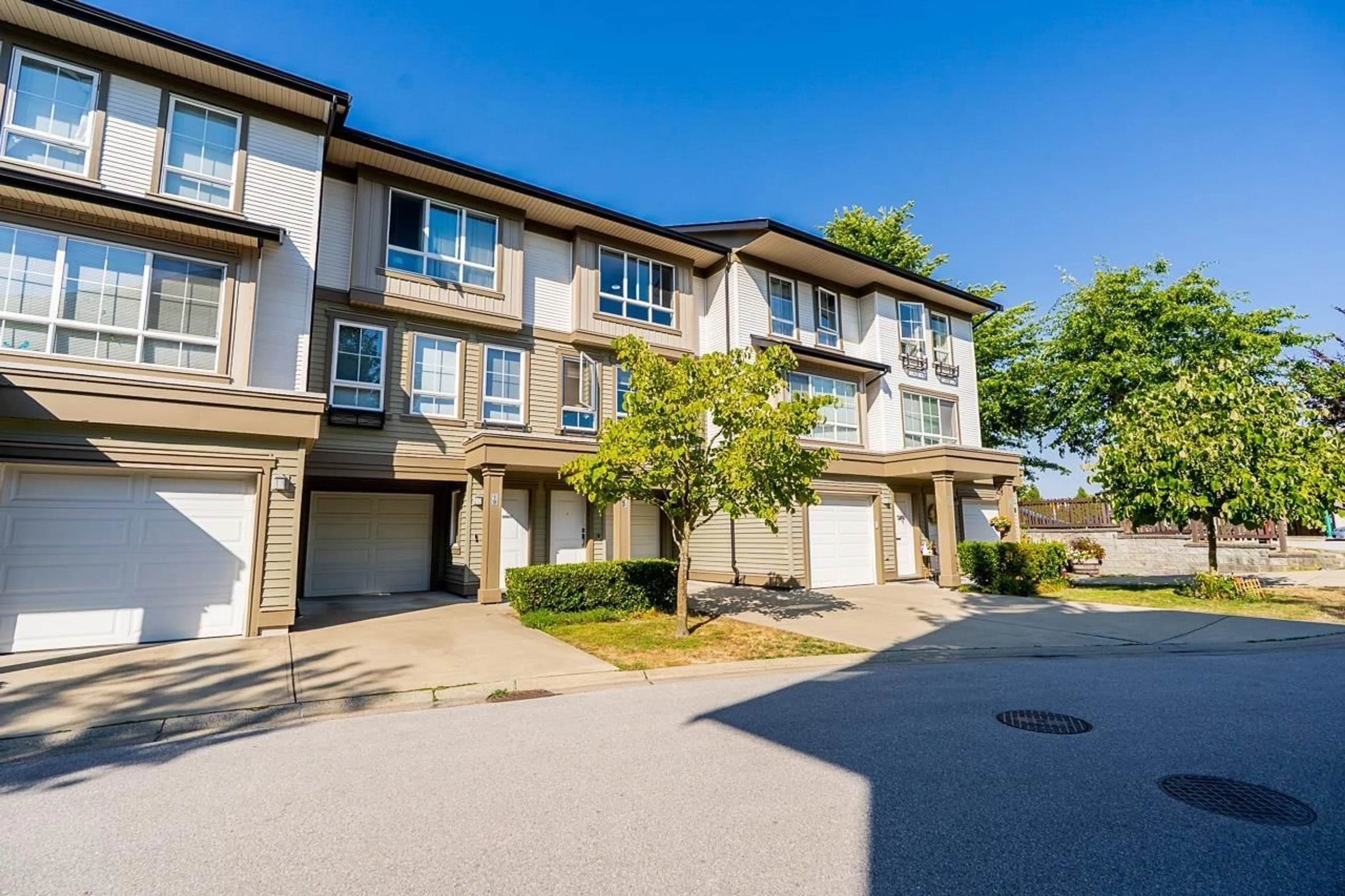 A pic from outside/outdoor area/front of a property/back of a property/a pic from drone, street for 18 - 19505 68A AVENUE, Surrey British Columbia V4N6K3