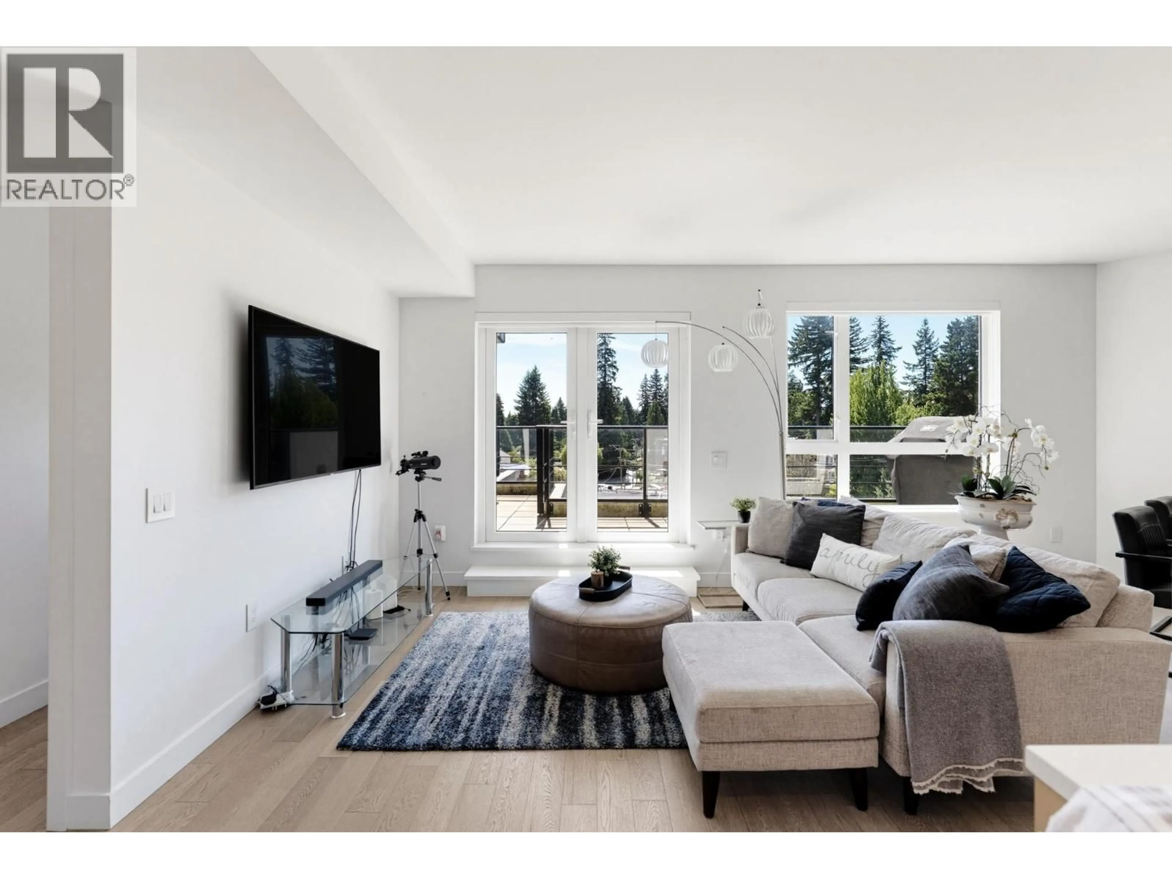 Living room with furniture, unknown for 409 - 3220 CONNAUGHT CRESCENT, North Vancouver British Columbia V7R0A5