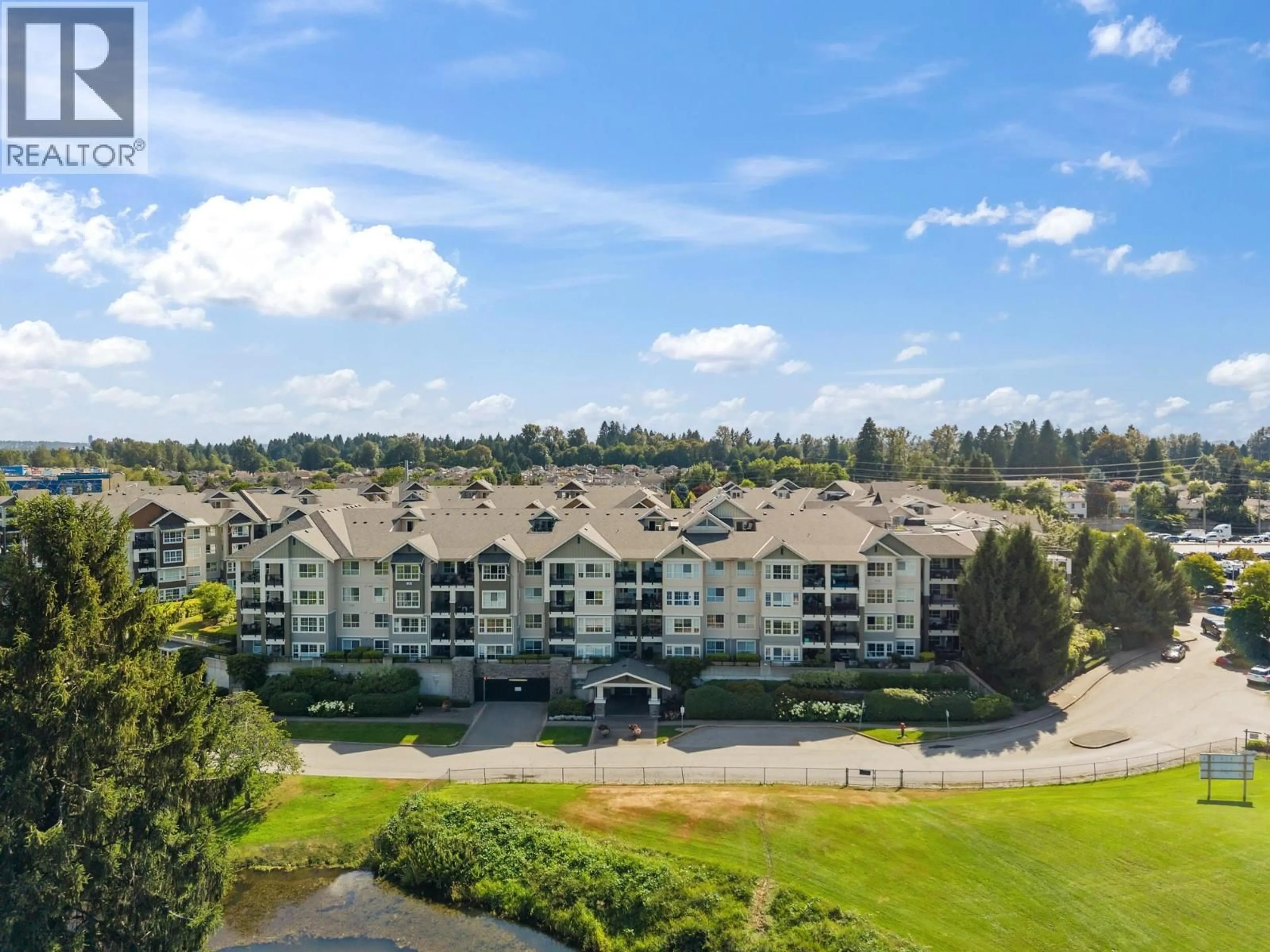 A pic from outside/outdoor area/front of a property/back of a property/a pic from drone, water/lake/river/ocean view for 104 - 19673 MEADOW GARDENS WAY, Pitt Meadows British Columbia V3Y0A1