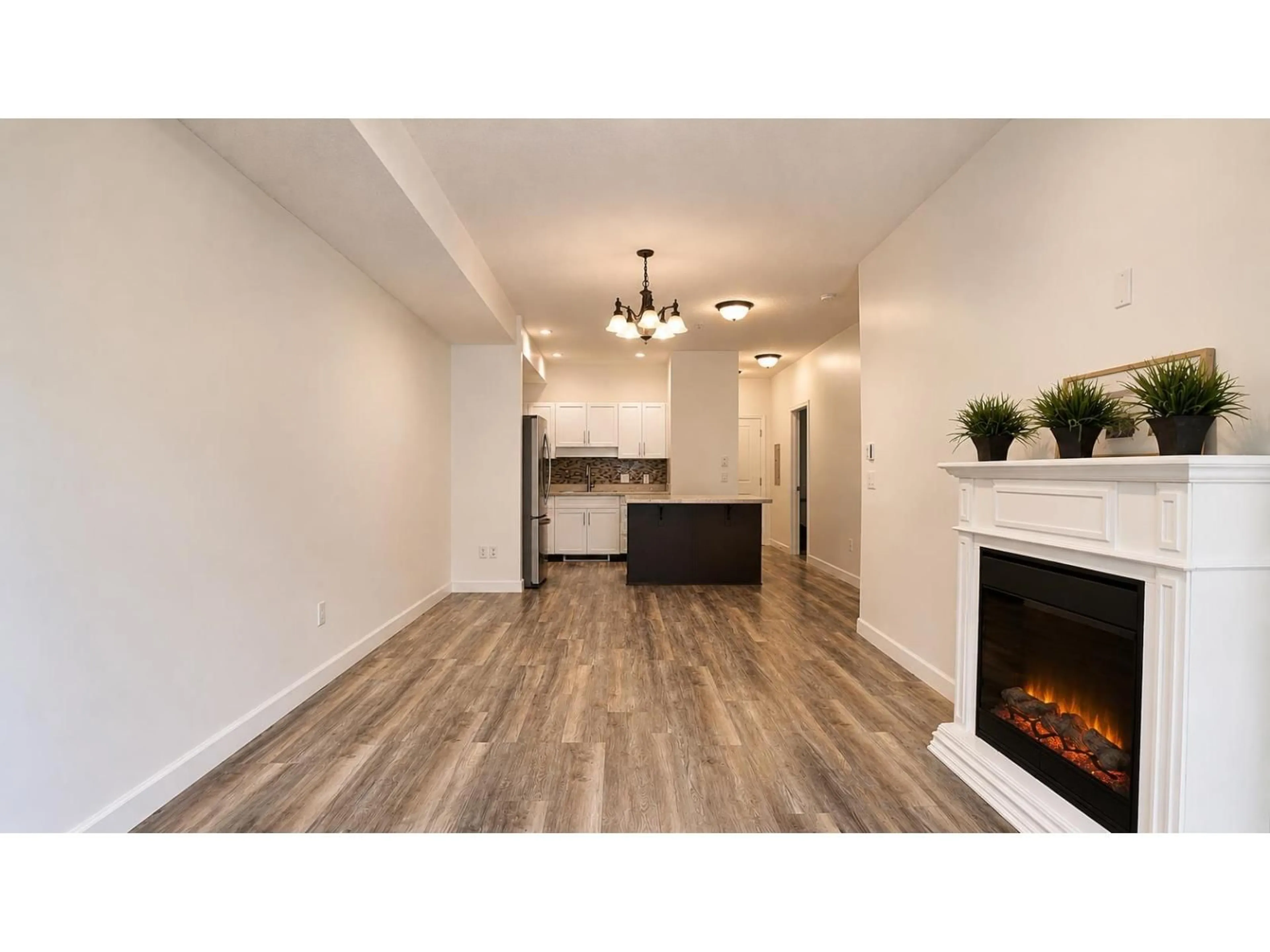 Open concept kitchen, wood/laminate floor for 209 - 20281 53A AVENUE, Langley British Columbia V3A3V6