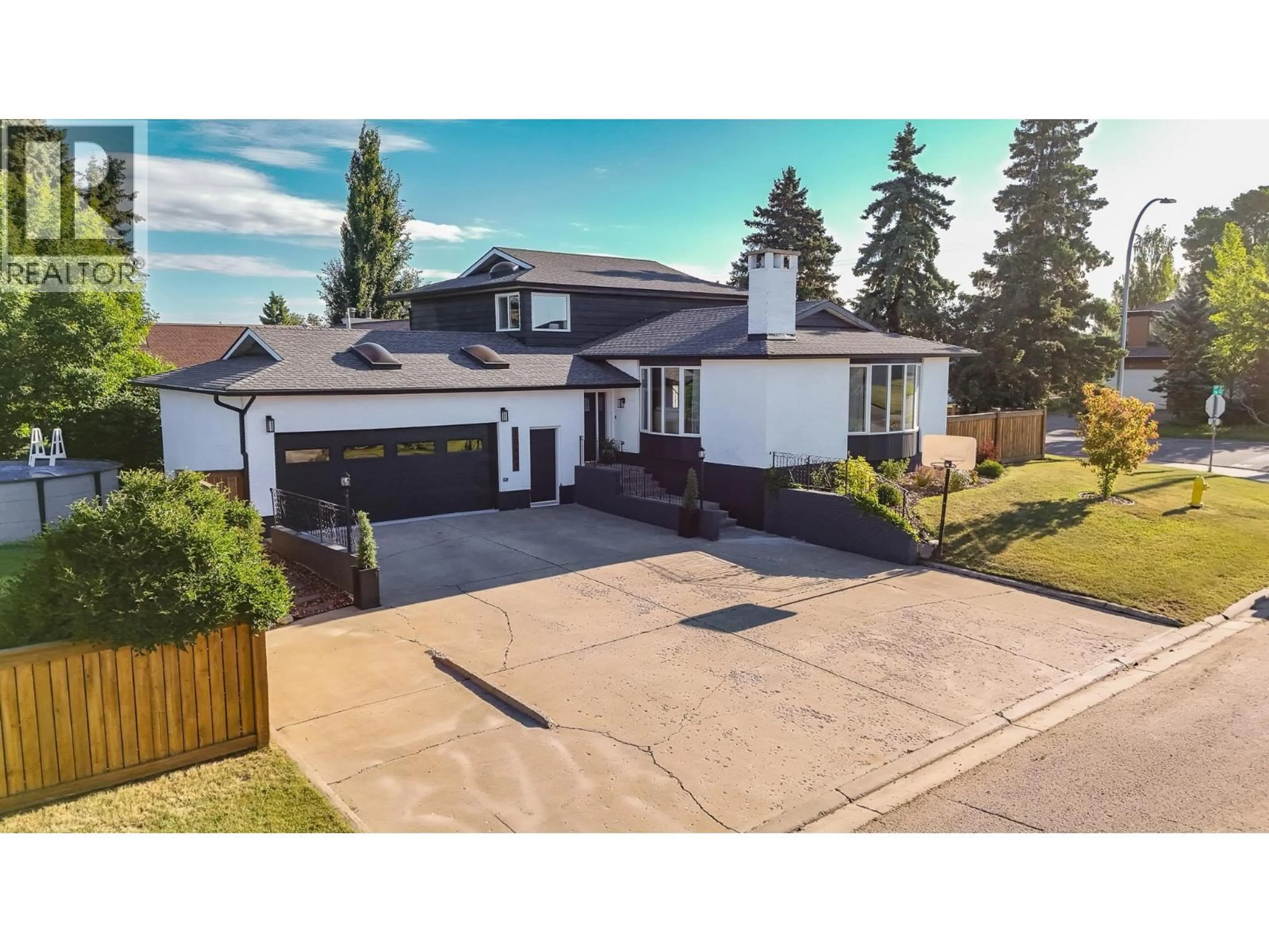 A pic from outside/outdoor area/front of a property/back of a property/a pic from drone, street for 10604 106 AVENUE, Fort St. John British Columbia V1J6E1