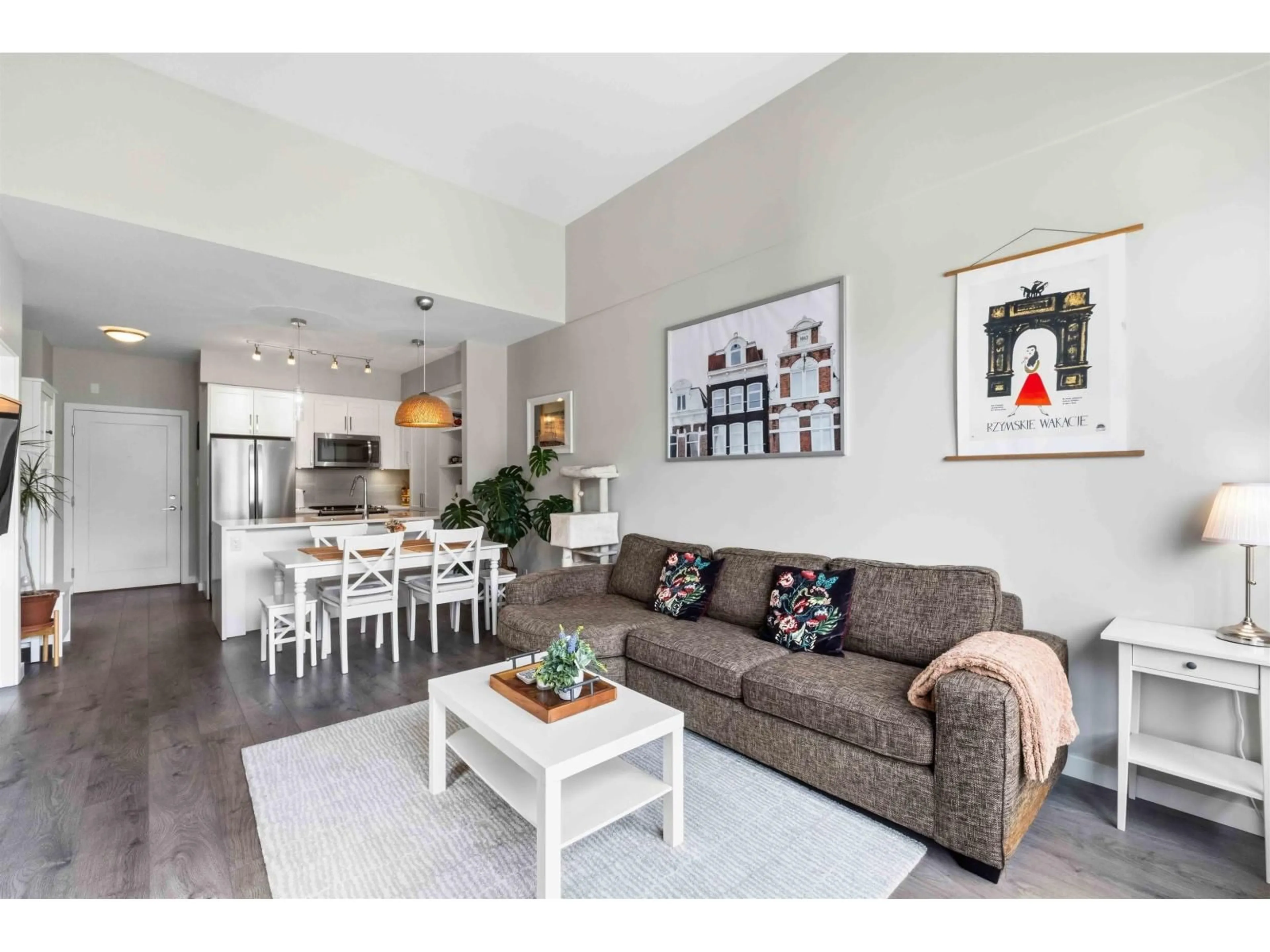 Living room with furniture, wood/laminate floor for E405 - 20211 66 AVENUE, Langley British Columbia V2Y0L4