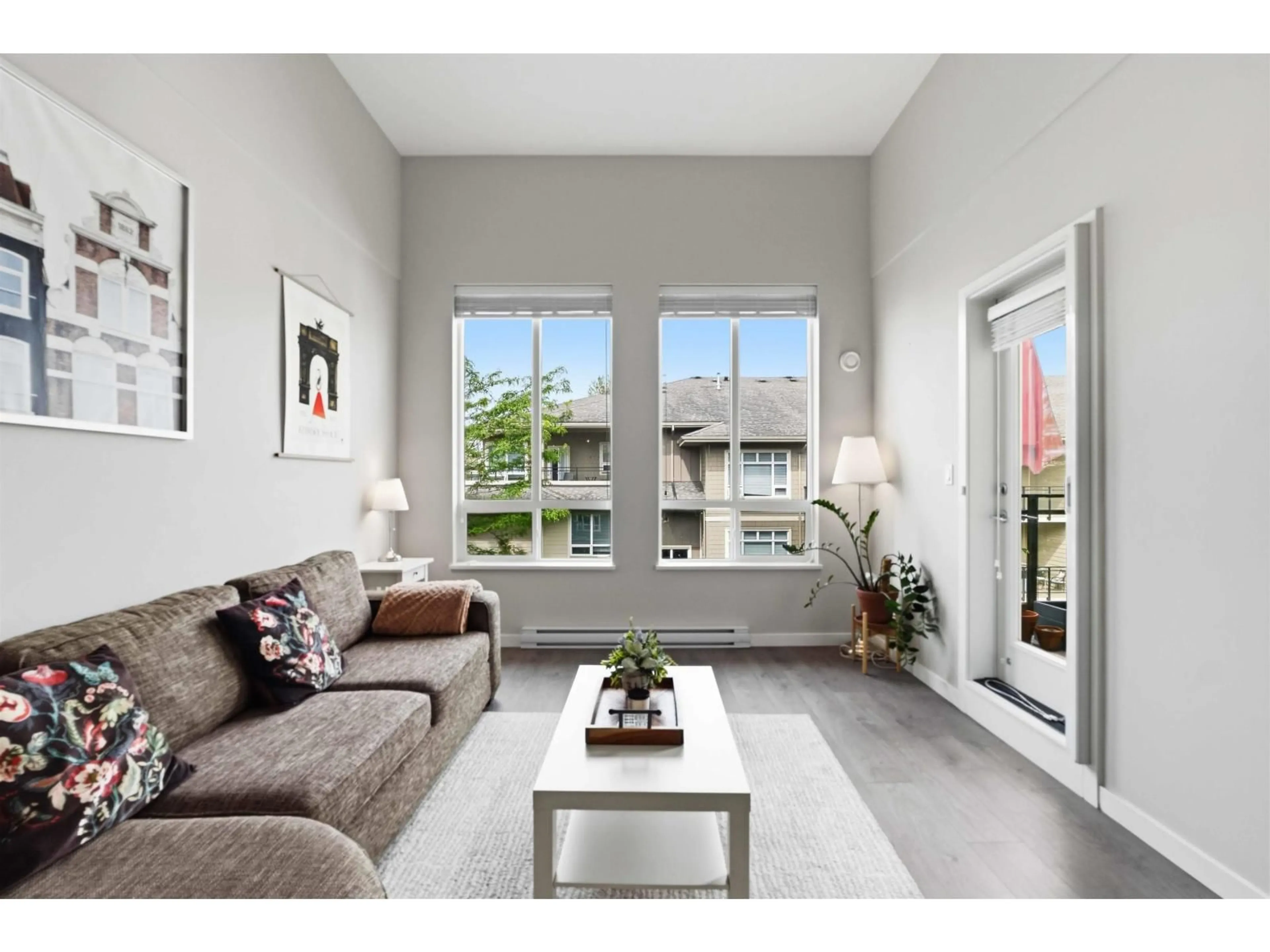 Living room with furniture, wood/laminate floor for E405 - 20211 66 AVENUE, Langley British Columbia V2Y0L4