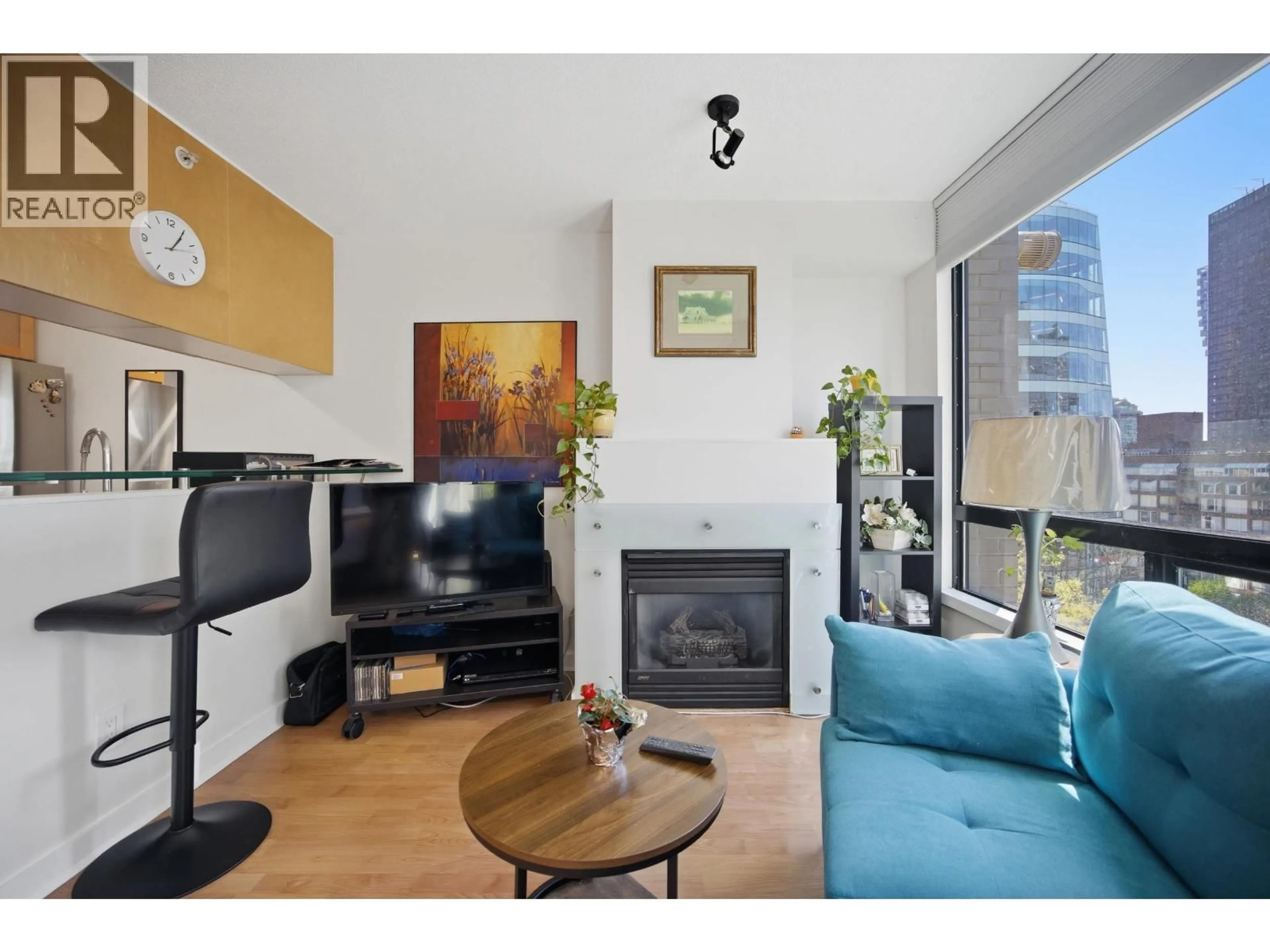 Living room with furniture, wood/laminate floor for 706 - 1003 BURNABY STREET, Vancouver British Columbia V6E4R7