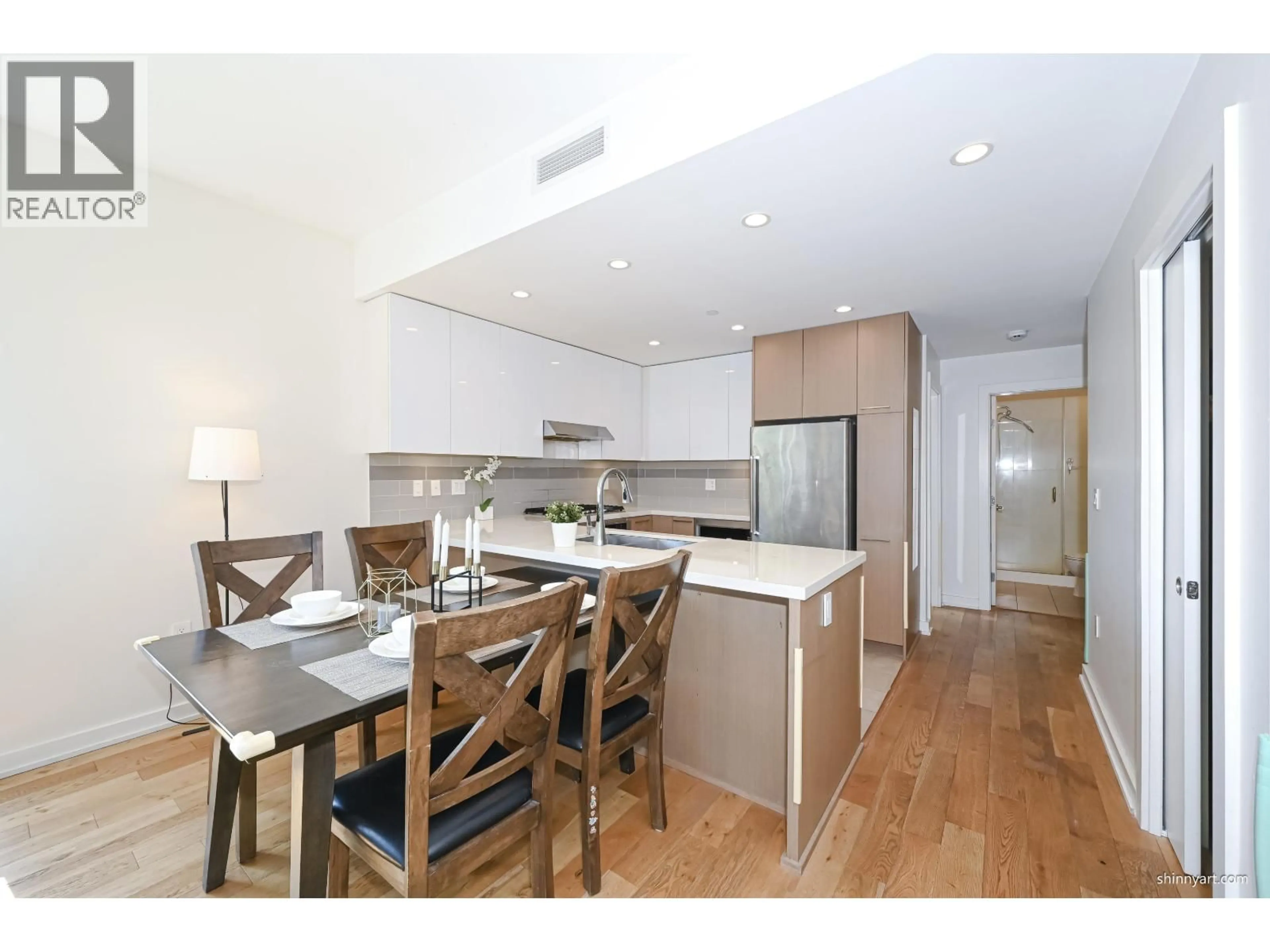 Open concept kitchen, wood/laminate floor for 321 - 5311 CEDARBRIDGE WAY, Richmond British Columbia V6X0M3