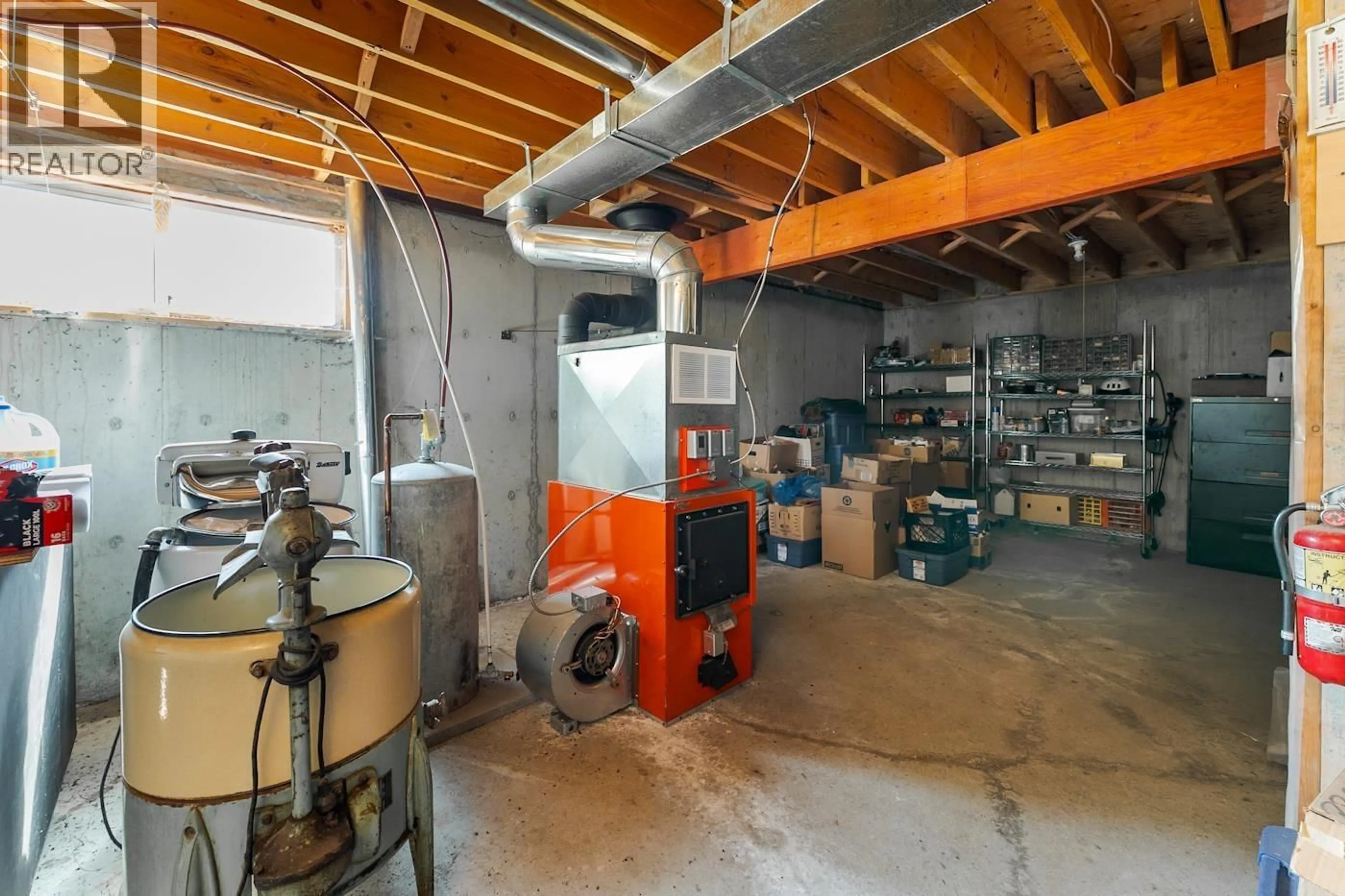 Kitchen with laundary machines, cement floor for 43000 MILNER ROAD, Quesnel British Columbia V0K1S1