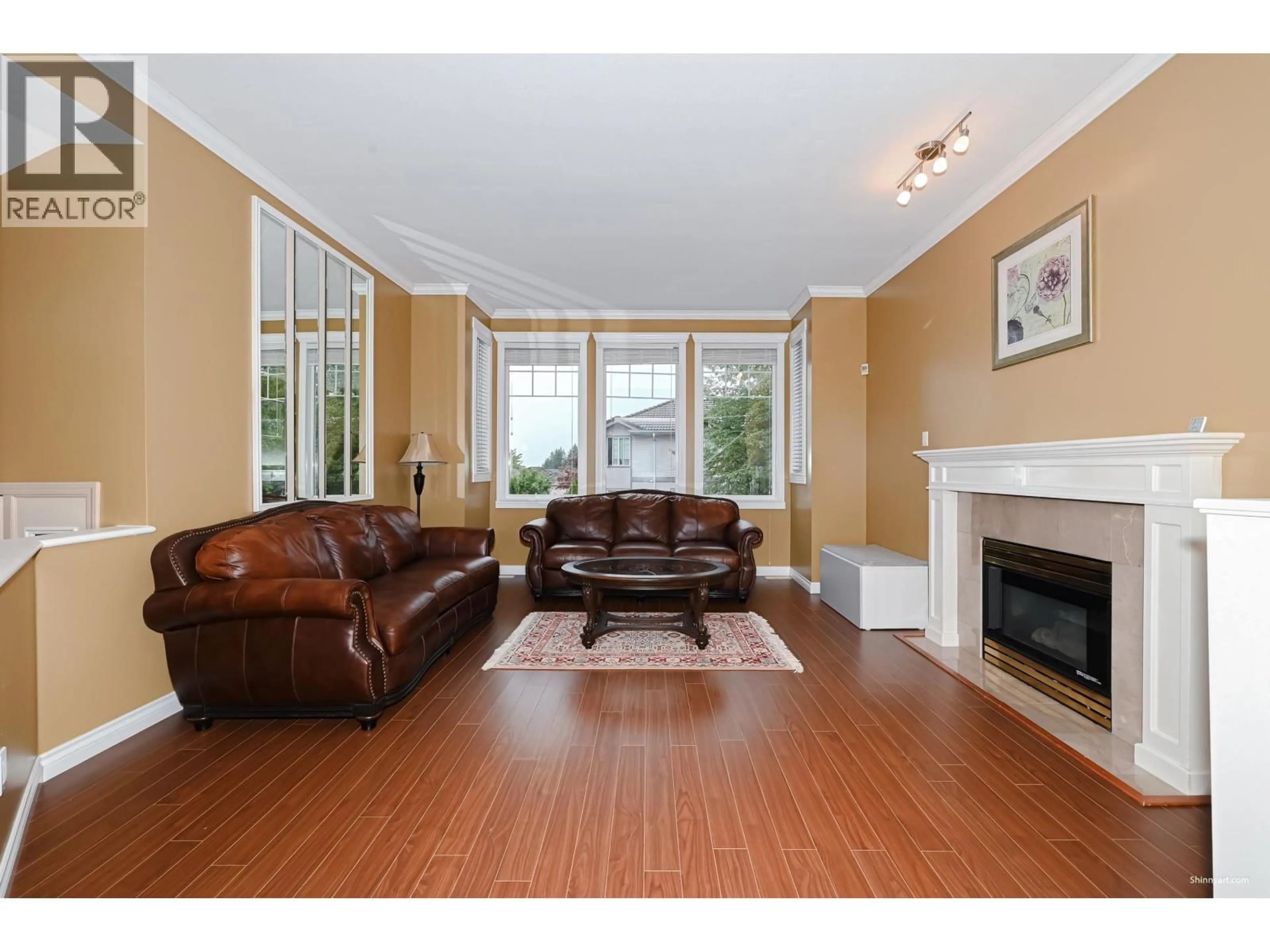 Living room with furniture, wood/laminate floor for 2995 PINETREE CLOSE, Coquitlam British Columbia V3E2Z5