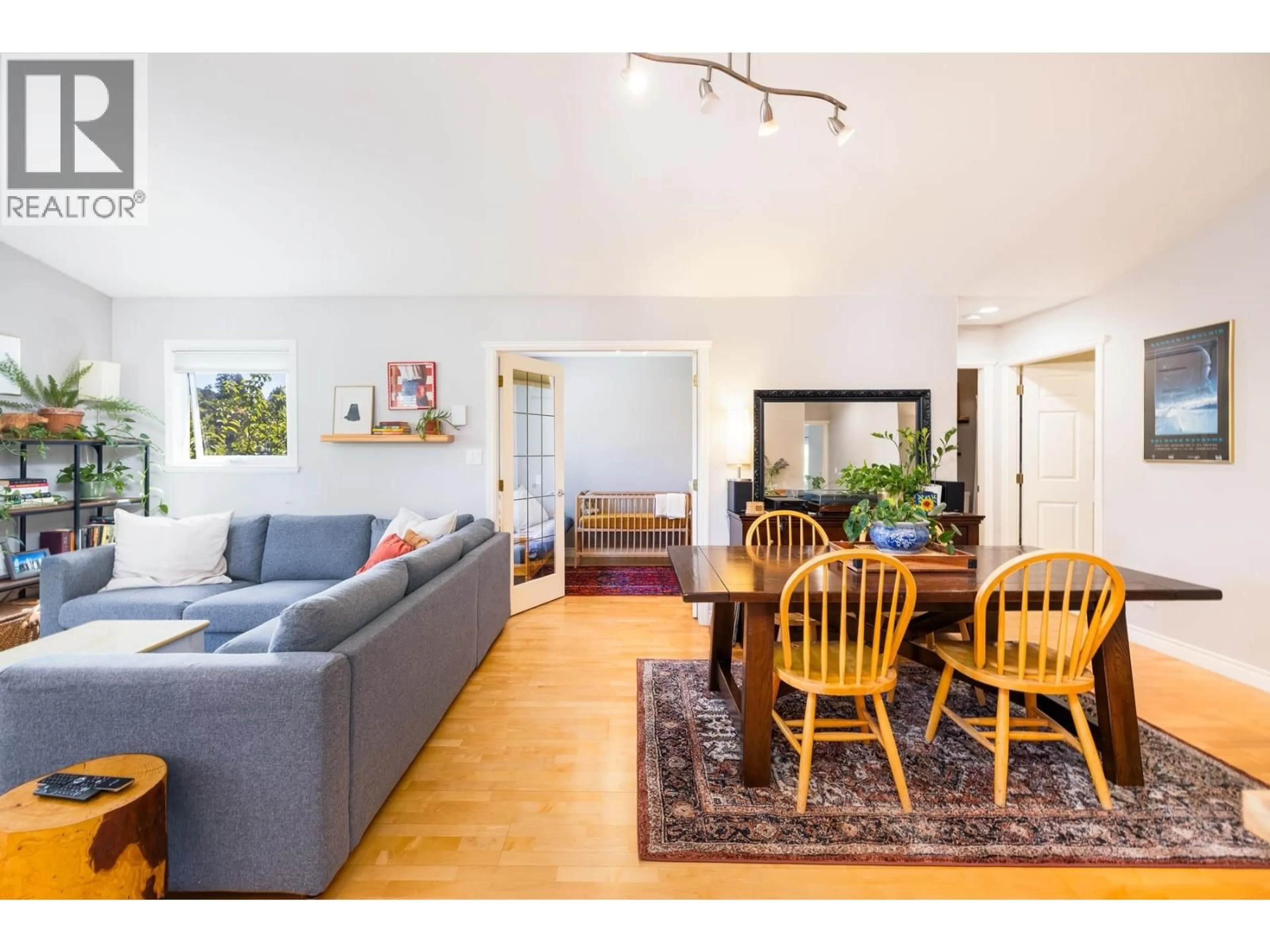 Living room with furniture, wood/laminate floor for 303 - 1528 BOWSER AVENUE, North Vancouver British Columbia V7P2Y3
