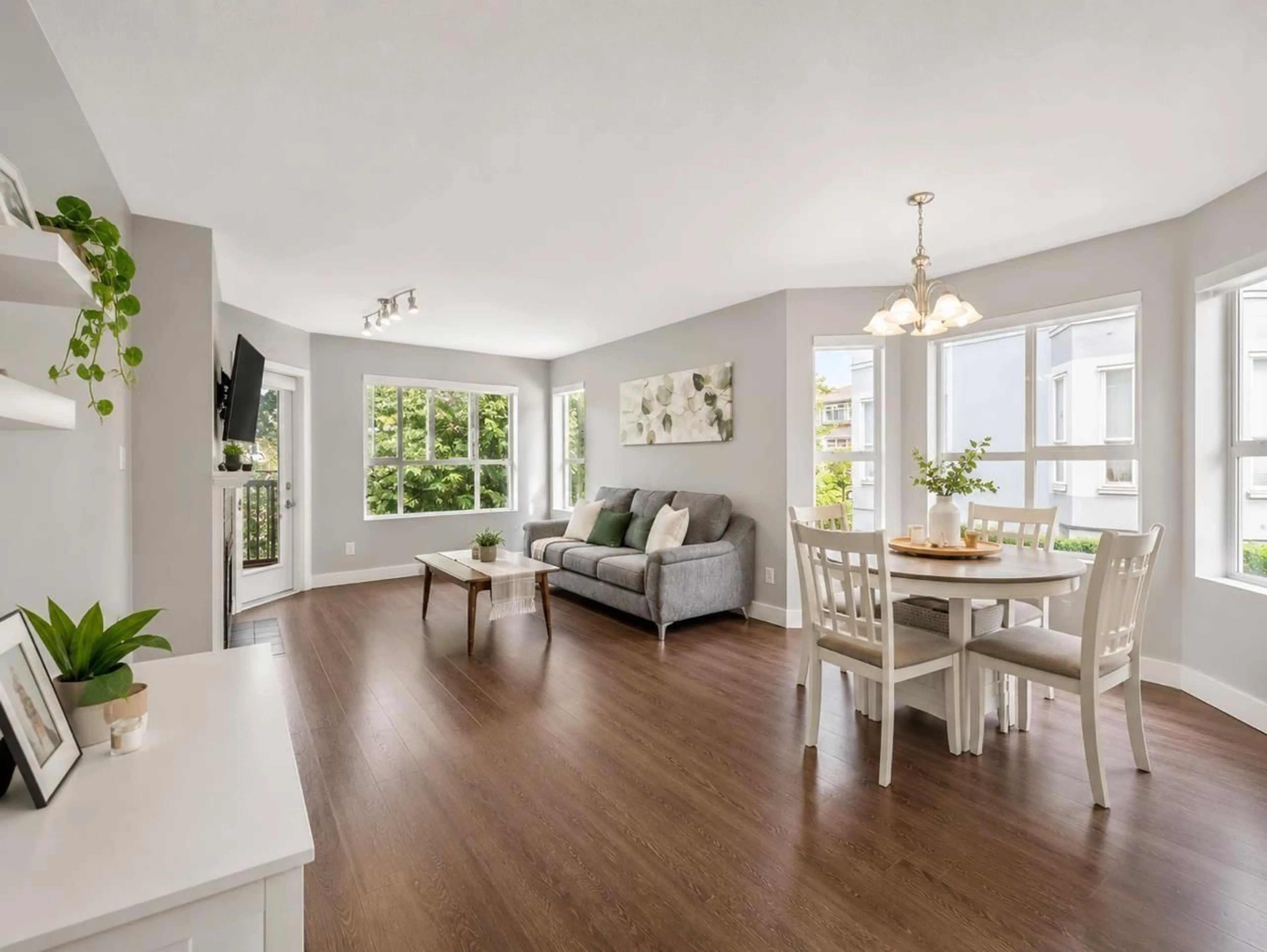 Living room with furniture, wood/laminate floor for 309 - 13939 LAUREL DRIVE, Surrey British Columbia V3T1A8