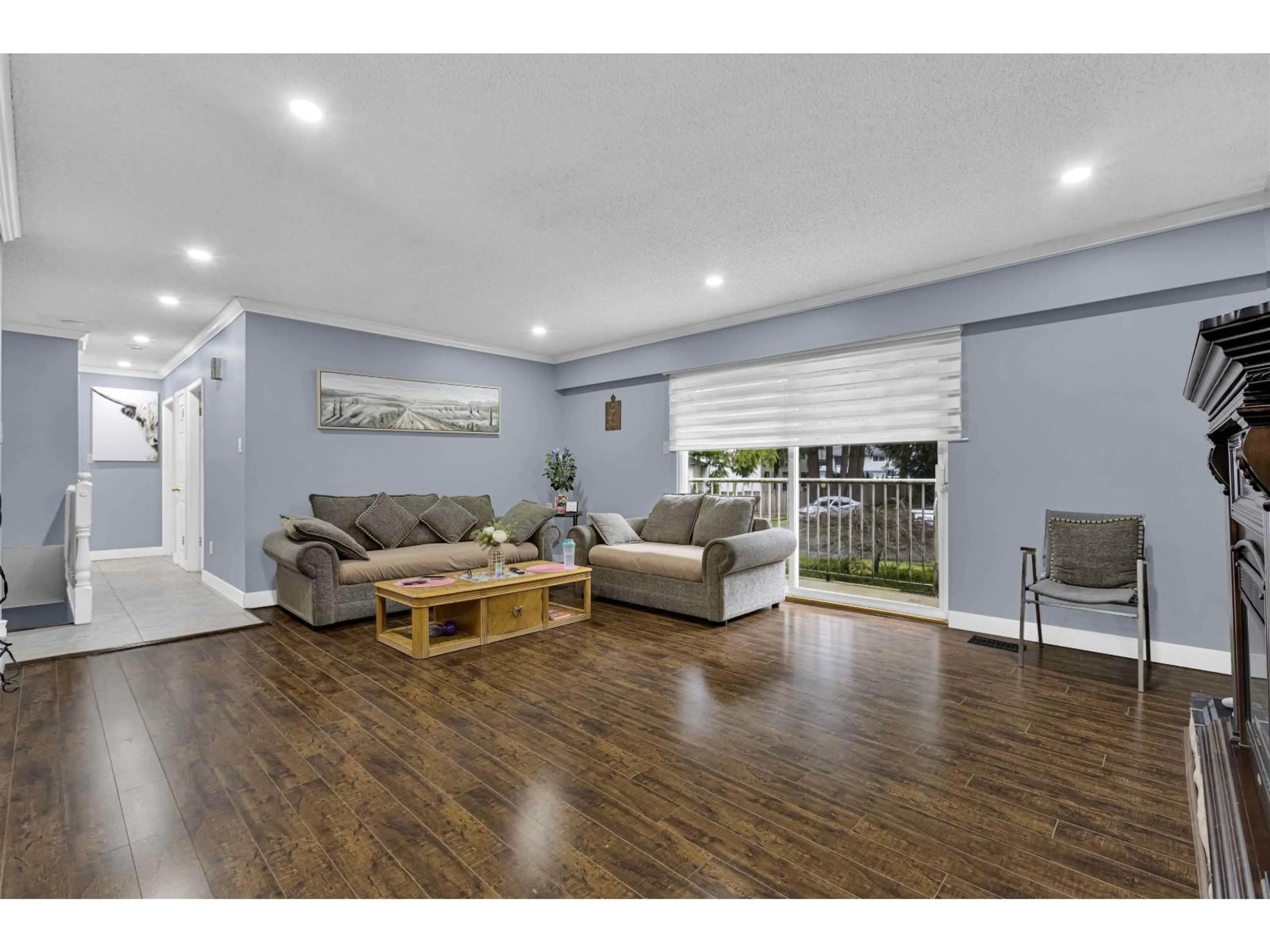 Living room with furniture, wood/laminate floor for 7059 BARKLEY PLACE, Delta British Columbia V4E1T8