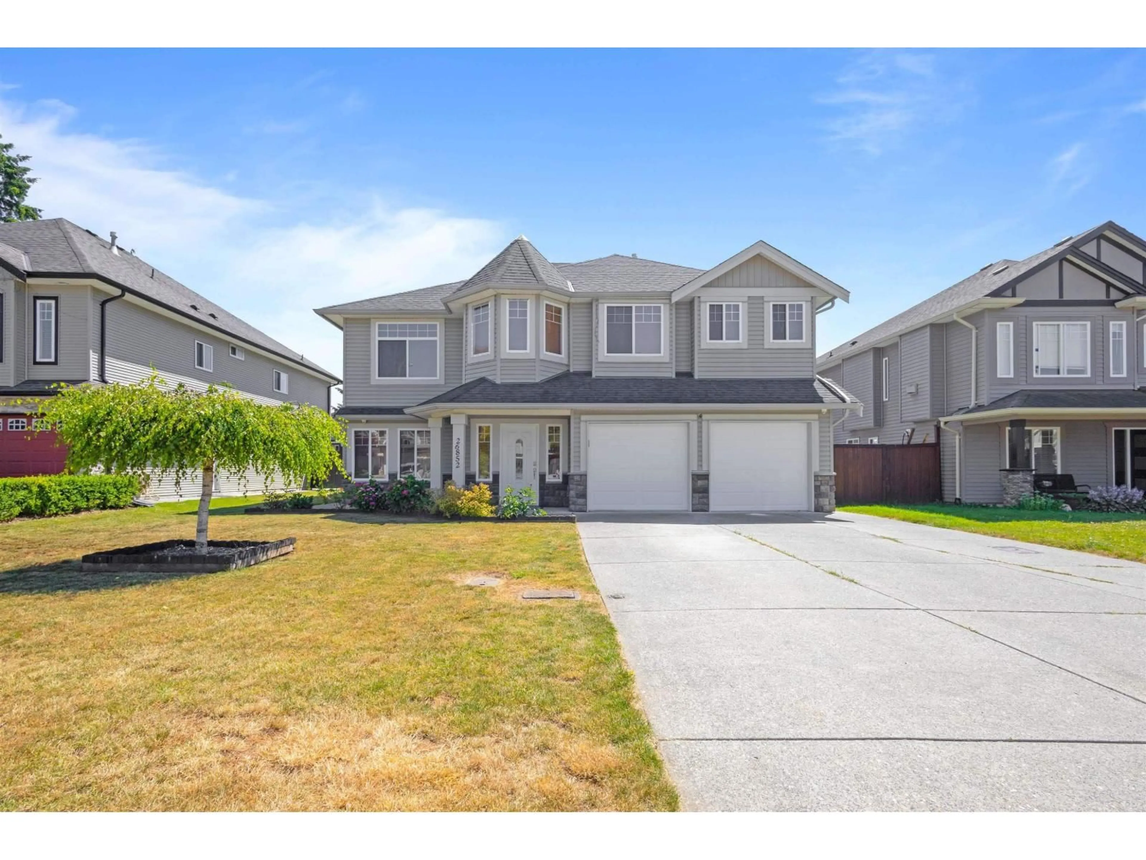 Home with vinyl exterior material, street for 26852 26A AVENUE, Langley British Columbia V4W3Z6