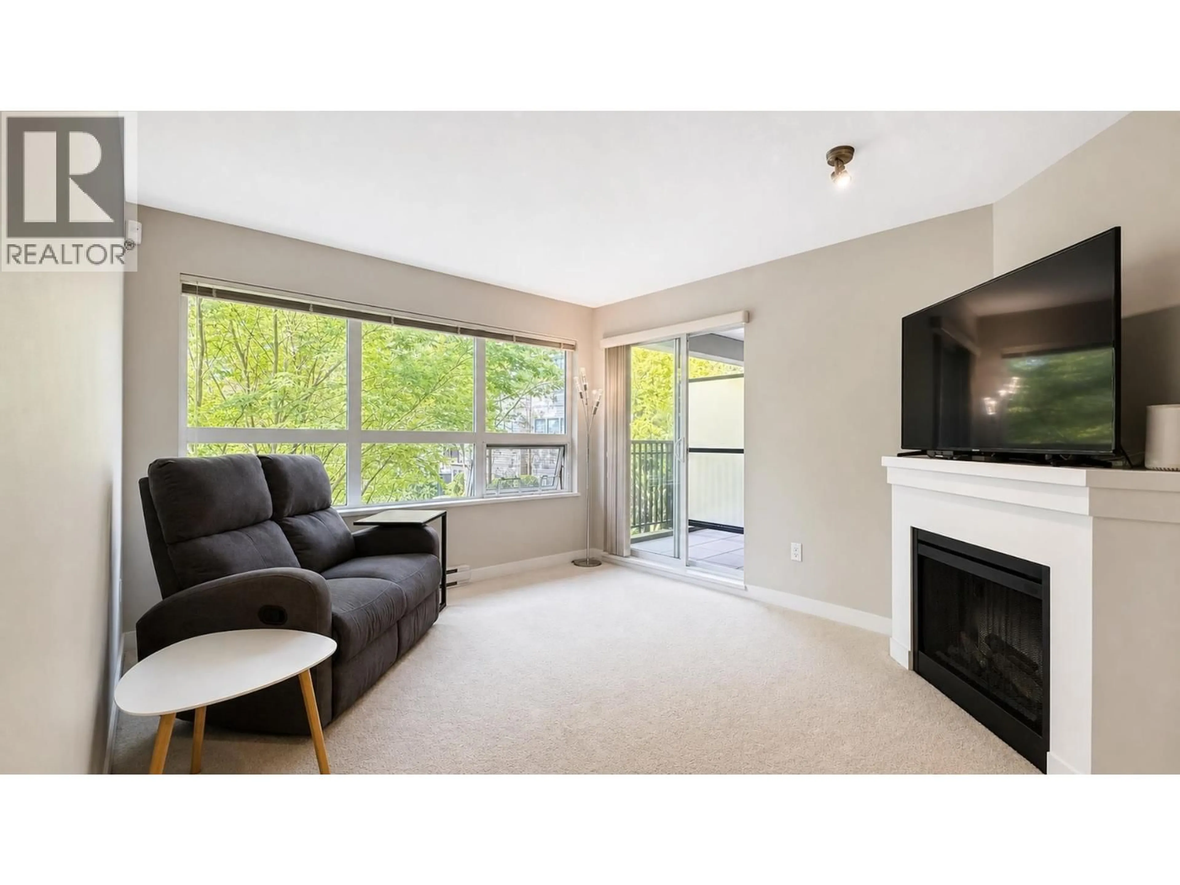 Living room with furniture, wood/laminate floor for 212 - 6828 ECKERSLEY ROAD, Richmond British Columbia V6Y0E8