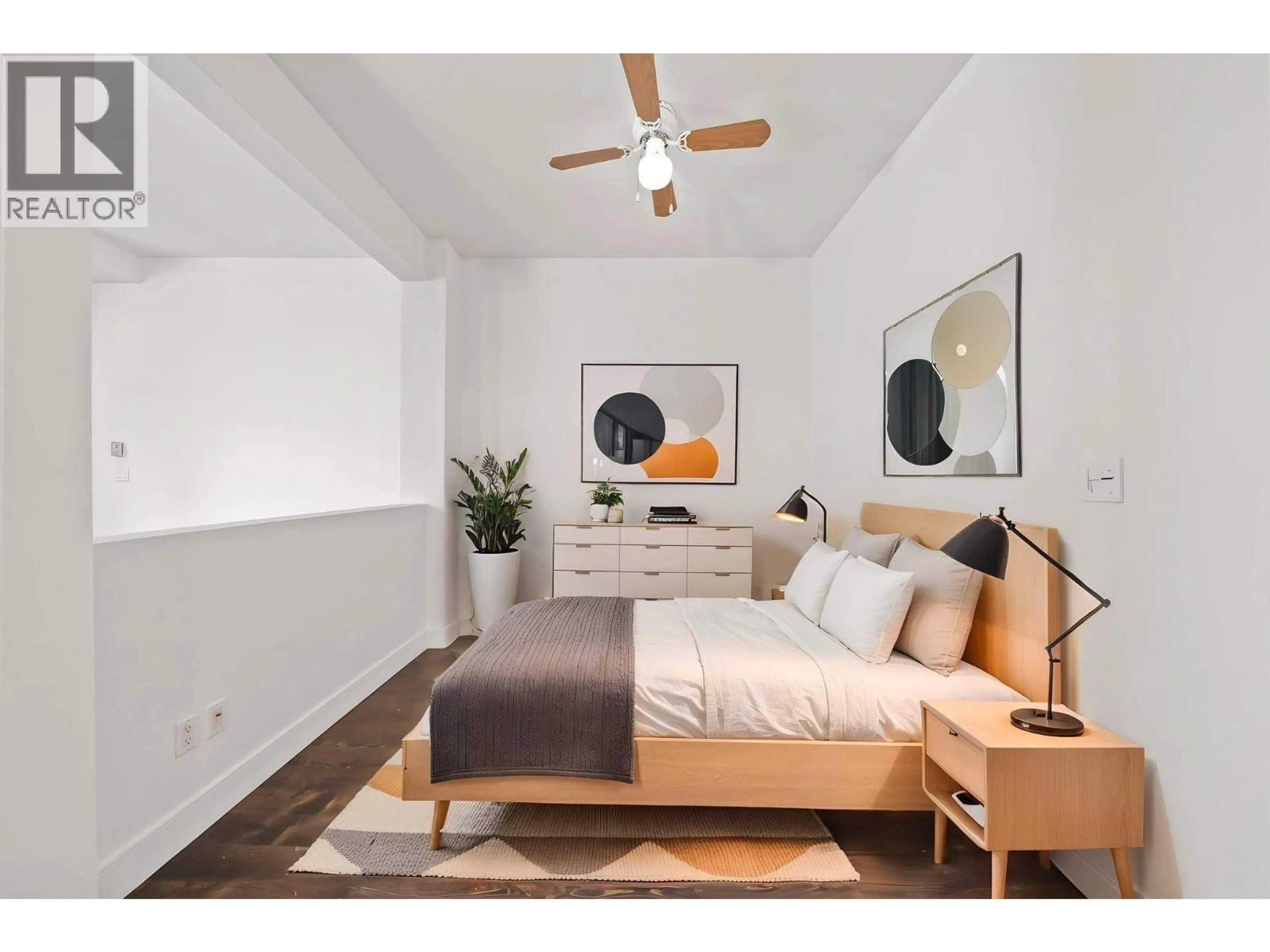Bedroom with bed, wood/laminate floor for 205 - 8988 HUDSON STREET, Vancouver British Columbia V6P6Z1