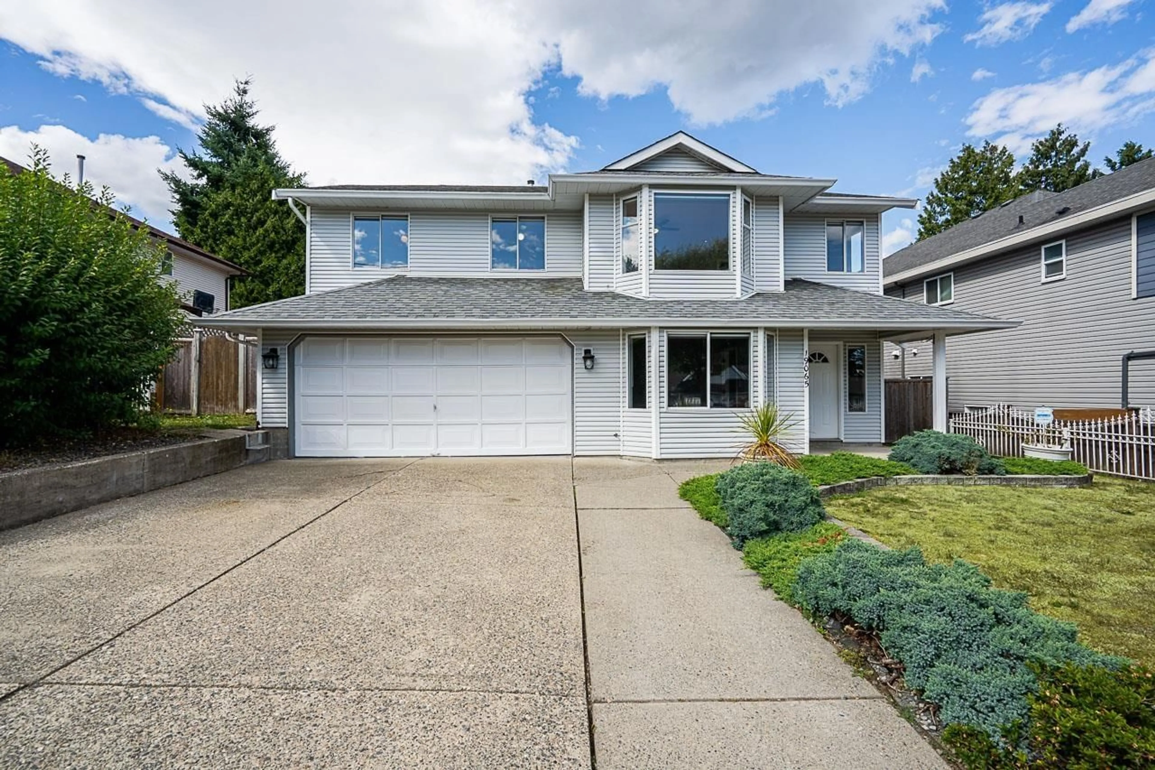 Home with vinyl exterior material, street for 19065 60 AVENUE, Surrey British Columbia V3S8A1