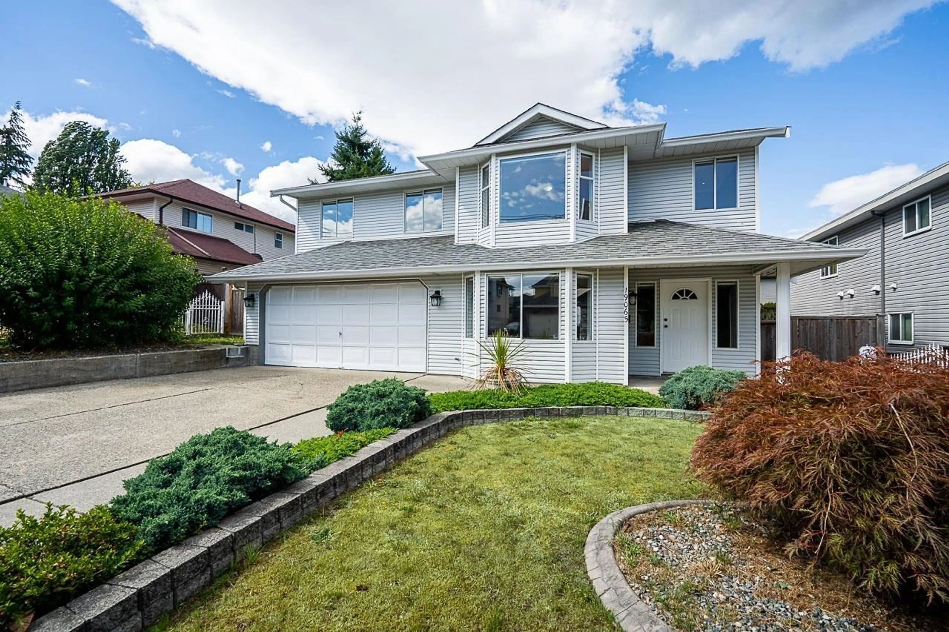 Home with vinyl exterior material, street for 19065 60 AVENUE, Surrey British Columbia V3S8A1