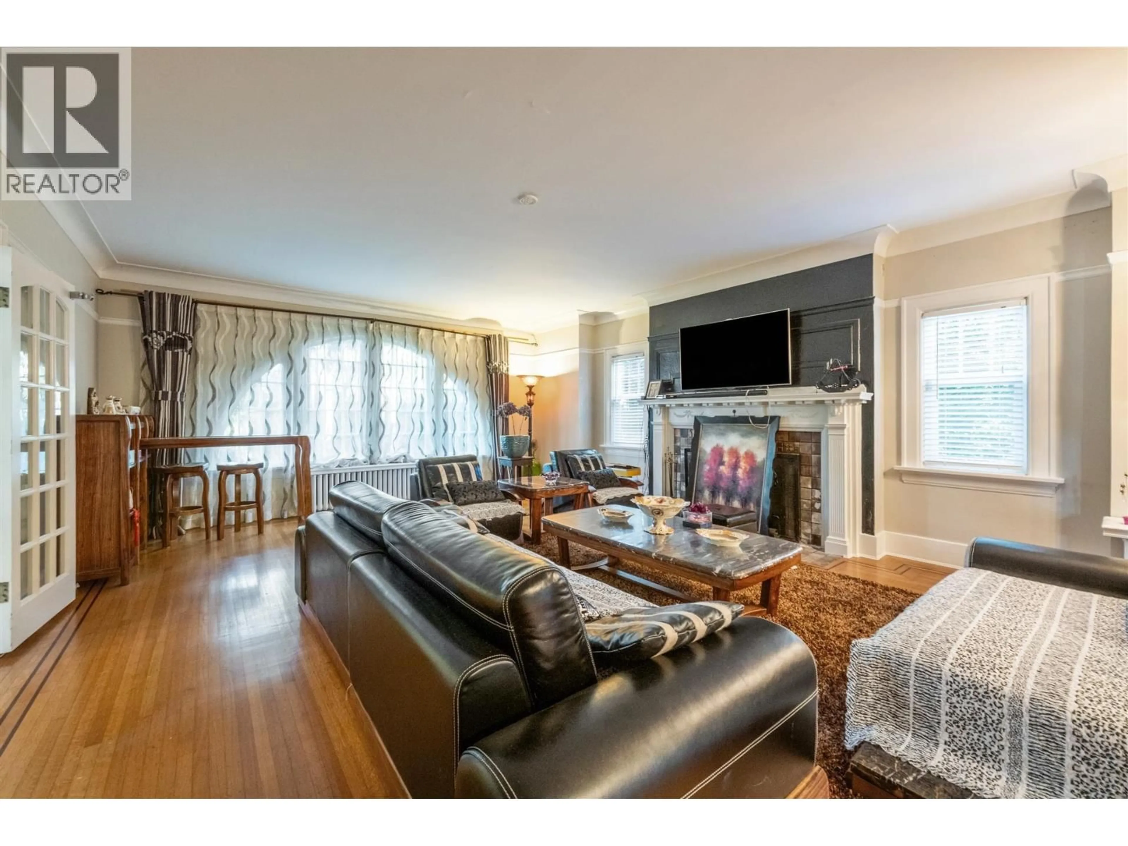 Living room with furniture, wood/laminate floor for 1516 BALFOUR AVENUE, Vancouver British Columbia V6J2T9