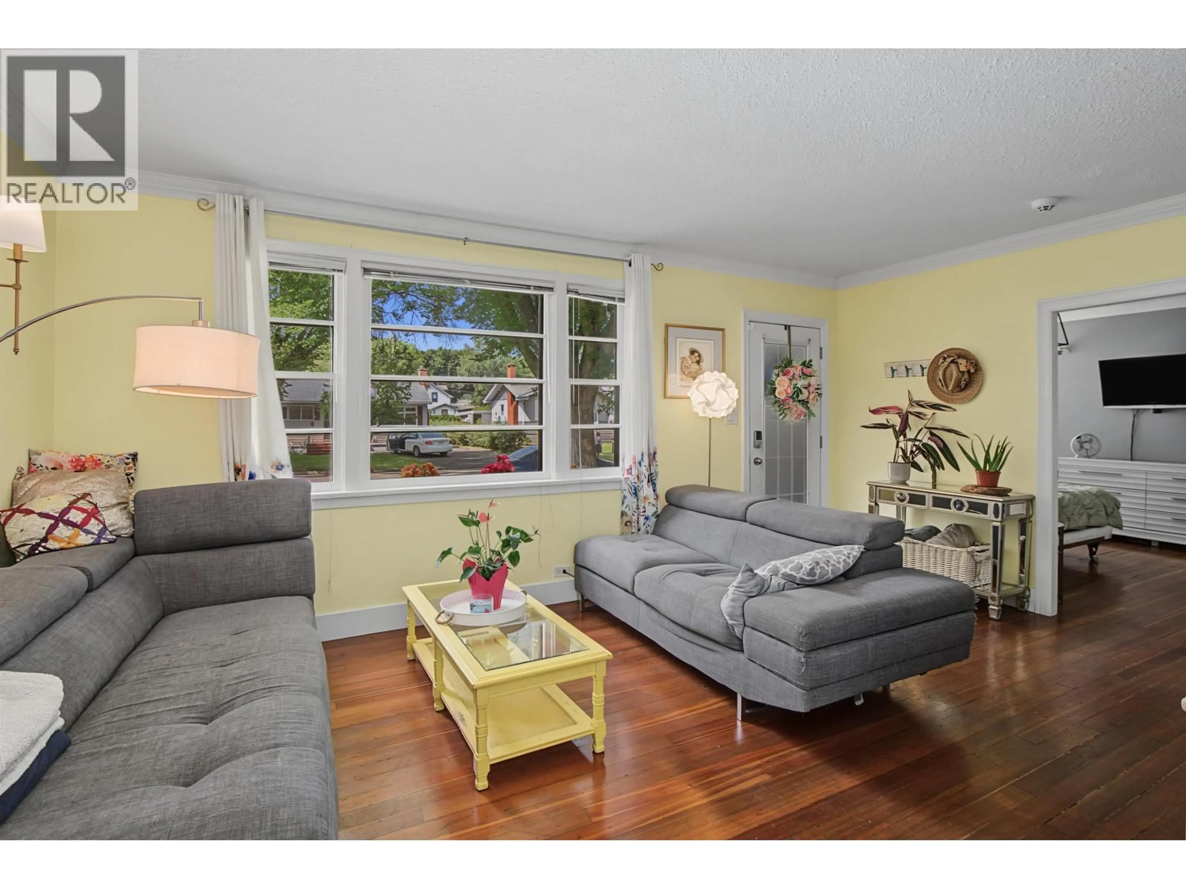 Living room with furniture, wood/laminate floor for 1450 FIR STREET, Prince George British Columbia V2L1E3