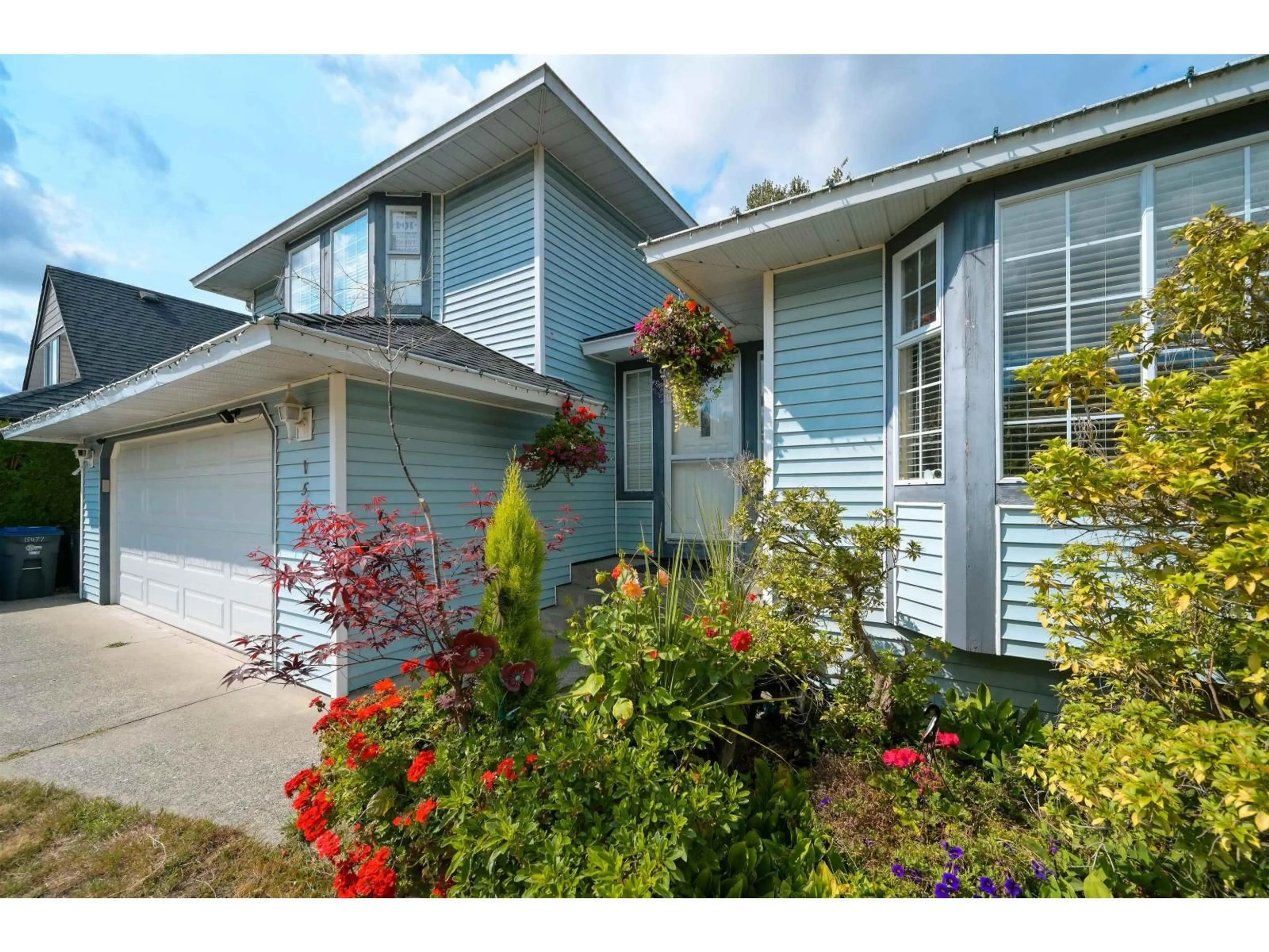 Home with vinyl exterior material, street for 15477 93A AVENUE, Surrey British Columbia V3R9P9