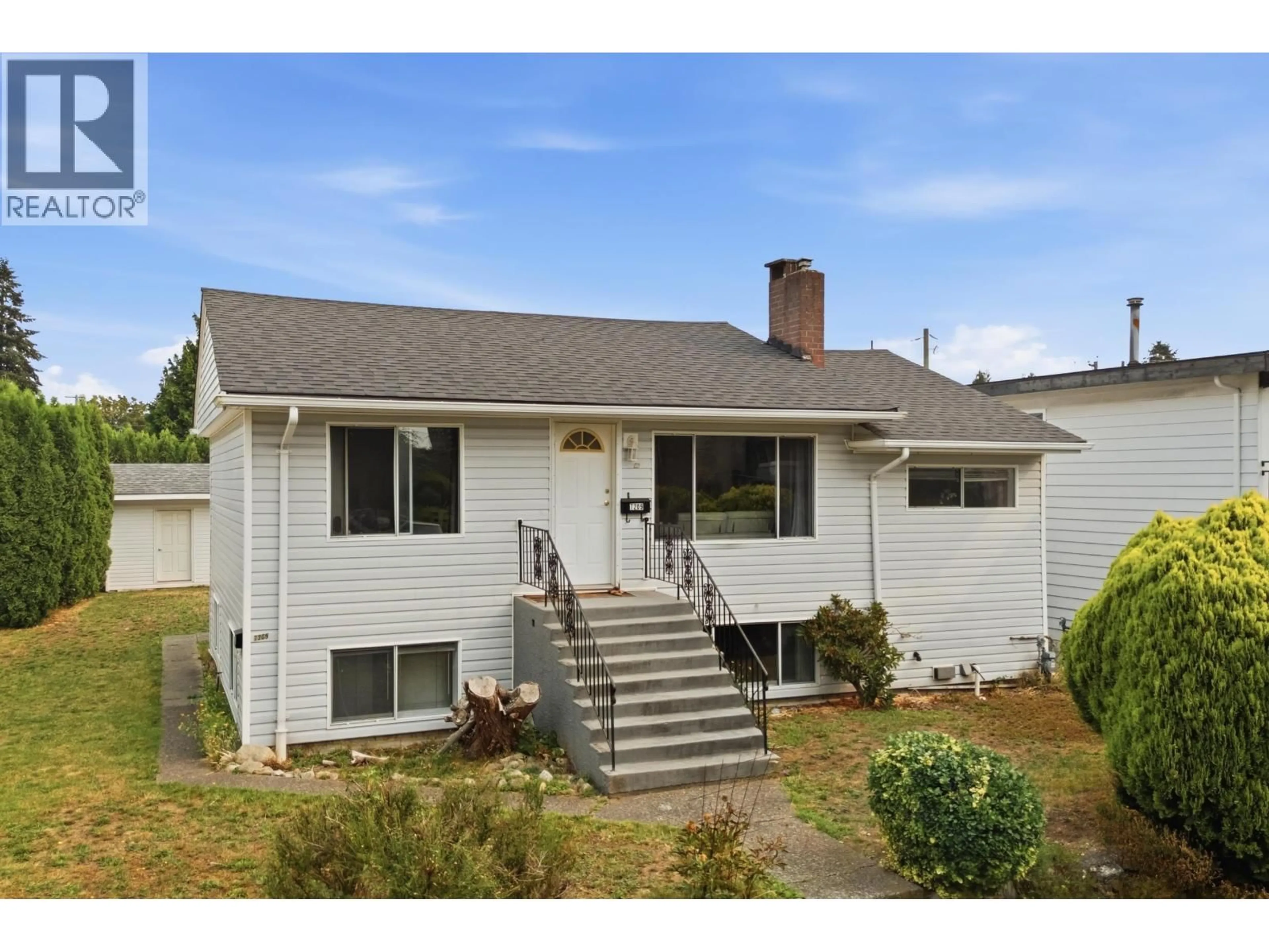 Home with vinyl exterior material, street for 7209 ELWELL STREET, Burnaby British Columbia V5E1K7