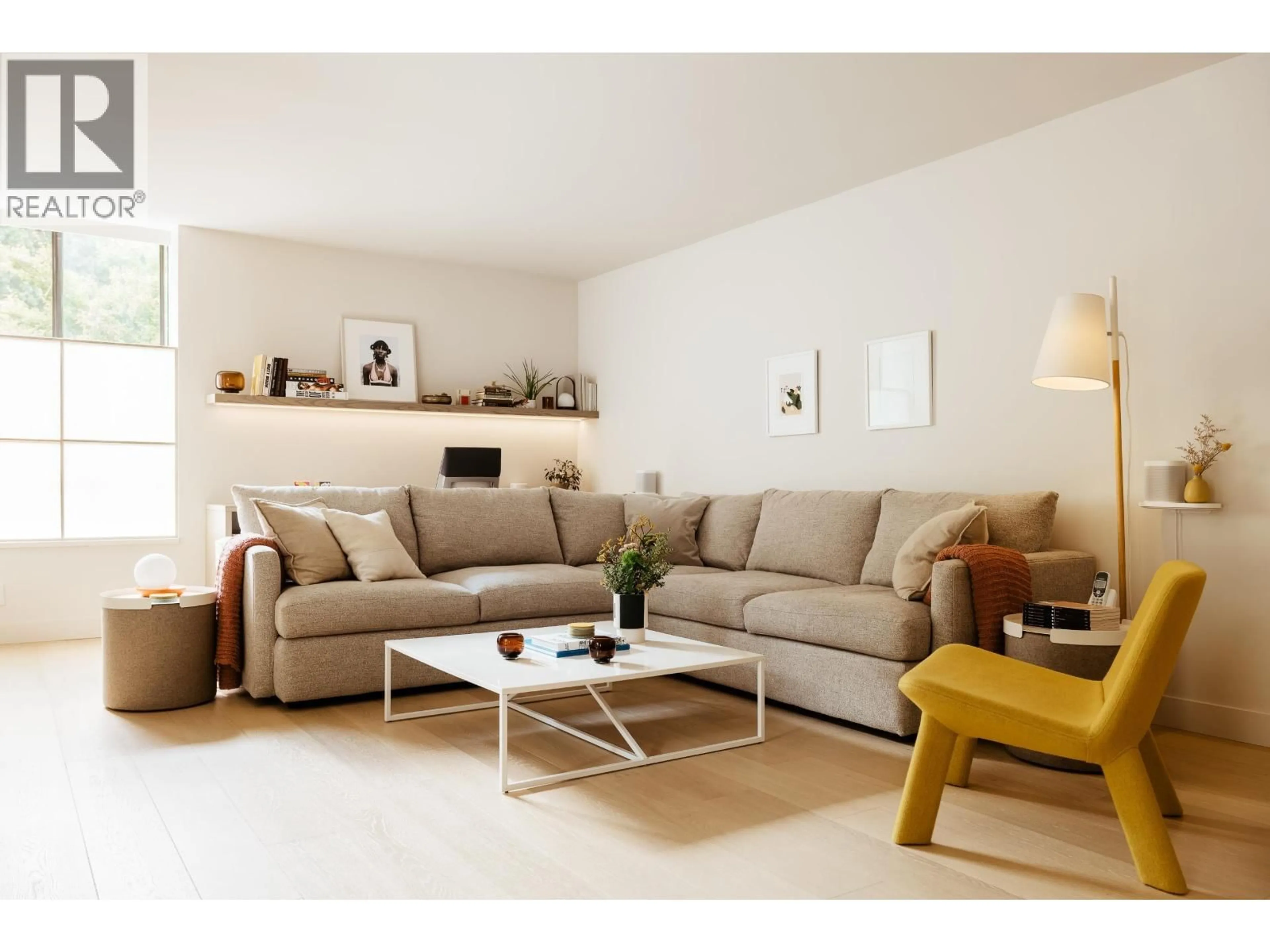 Living room with furniture, wood/laminate floor for 102 - 2140 BRIAR AVENUE, Vancouver British Columbia V6L3E3