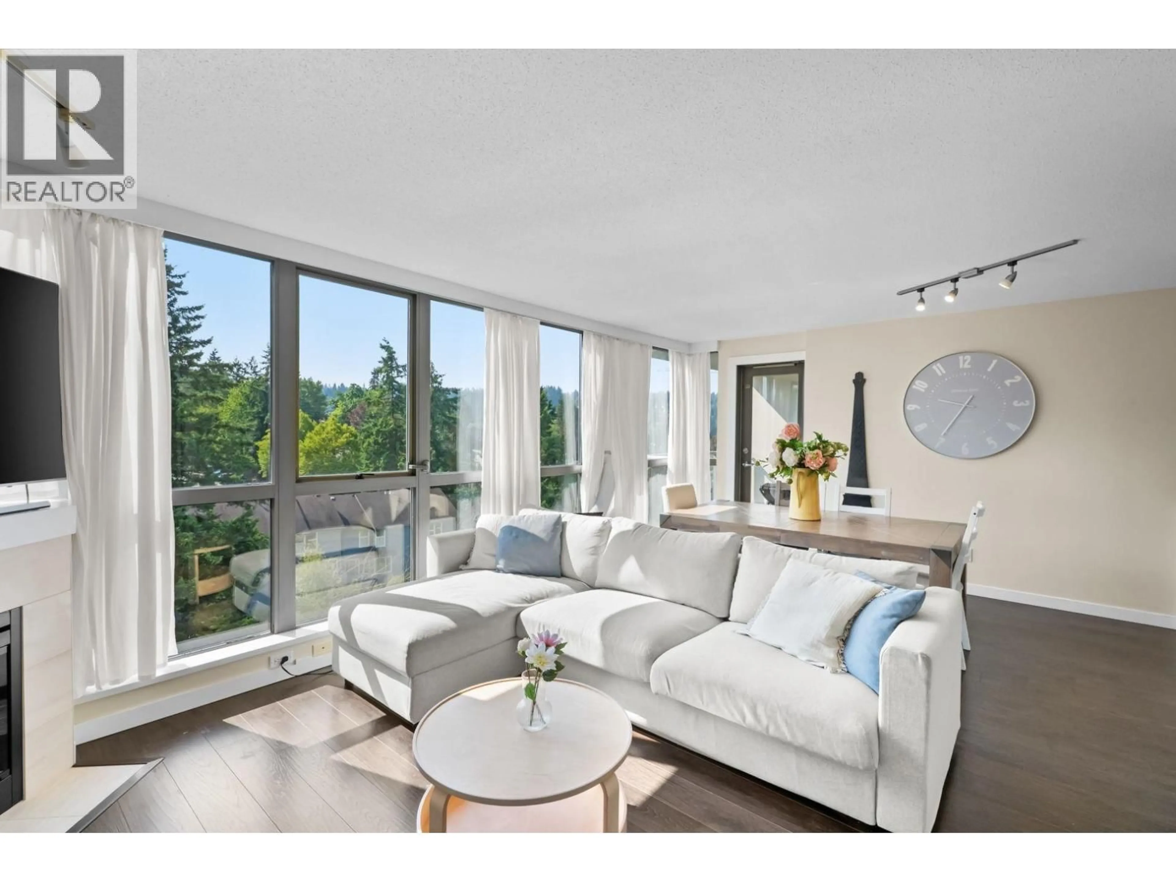 Living room with furniture, wood/laminate floor for 902 - 295 GUILDFORD WAY, Port Moody British Columbia V3H5N3