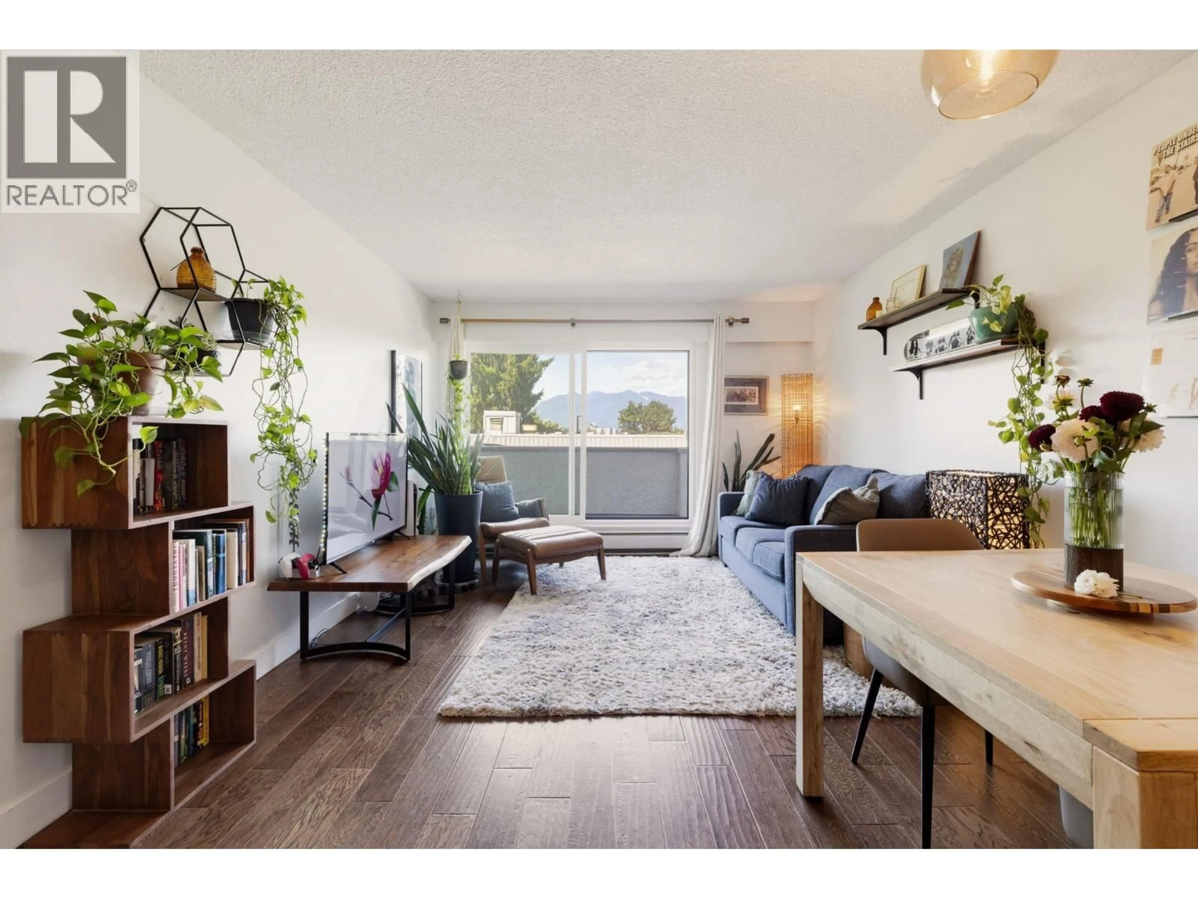 Living room with furniture, wood/laminate floor for 302 - 391 7TH AVENUE, Vancouver British Columbia V5T4H1