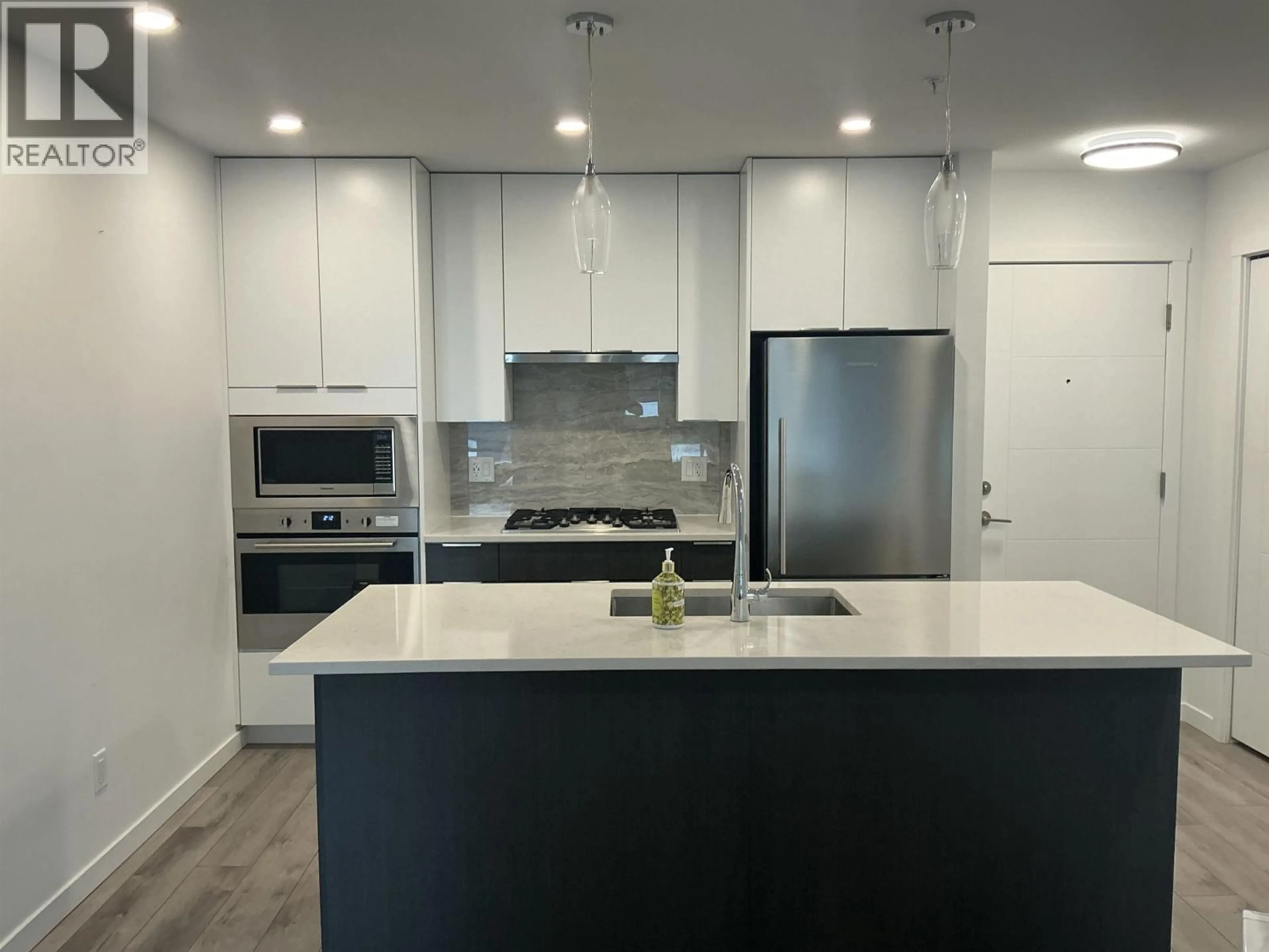 Open concept kitchen, wood/laminate floor for 504 - 11641 227 STREET, Maple Ridge British Columbia V2X9J6