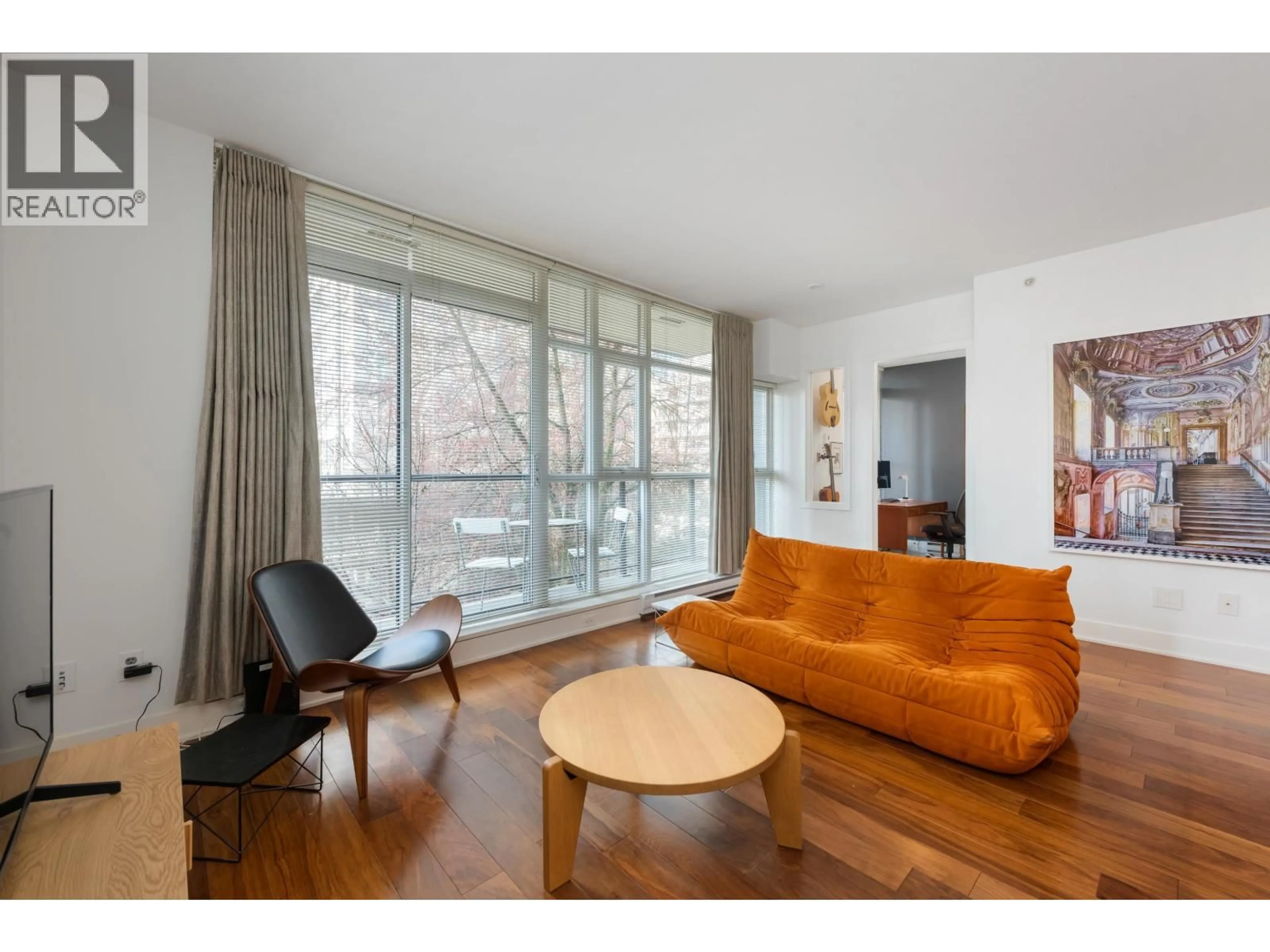 Living room with furniture, wood/laminate floor for 303 - 988 RICHARDS STREET, Vancouver British Columbia V6B8R2