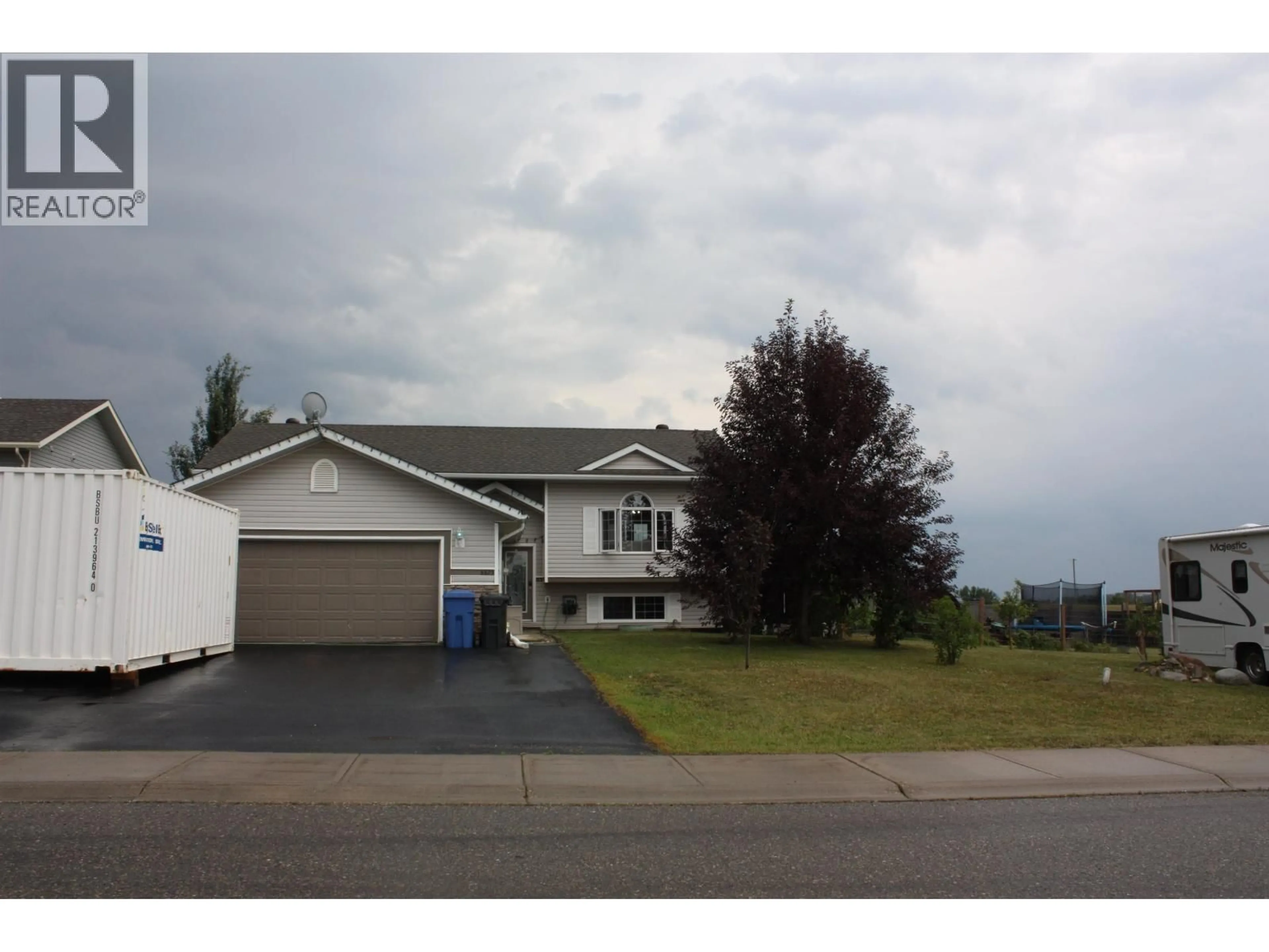 Home with vinyl exterior material, street for 8903 96A AVENUE, Fort St. John British Columbia V1J0A3