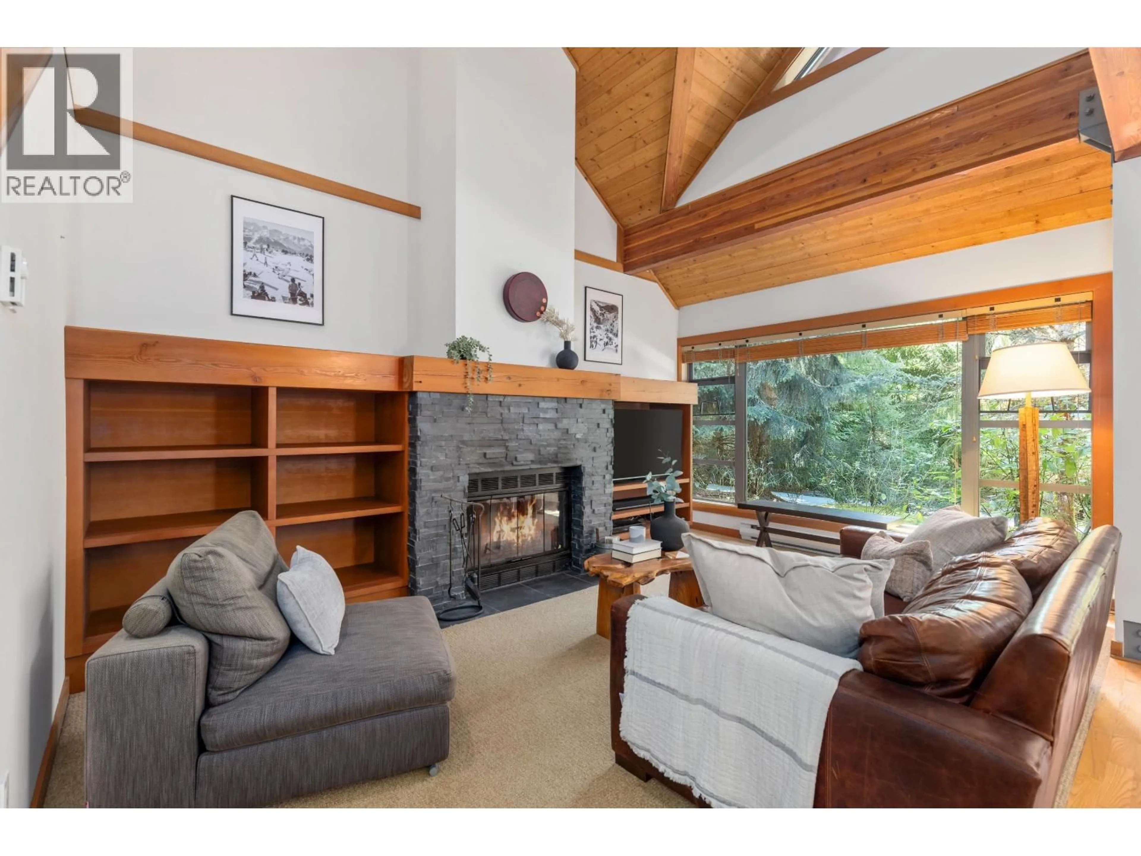 Living room with furniture, wood/laminate floor for 4603 MONTEBELLO PLACE, Whistler British Columbia V8E0Z4