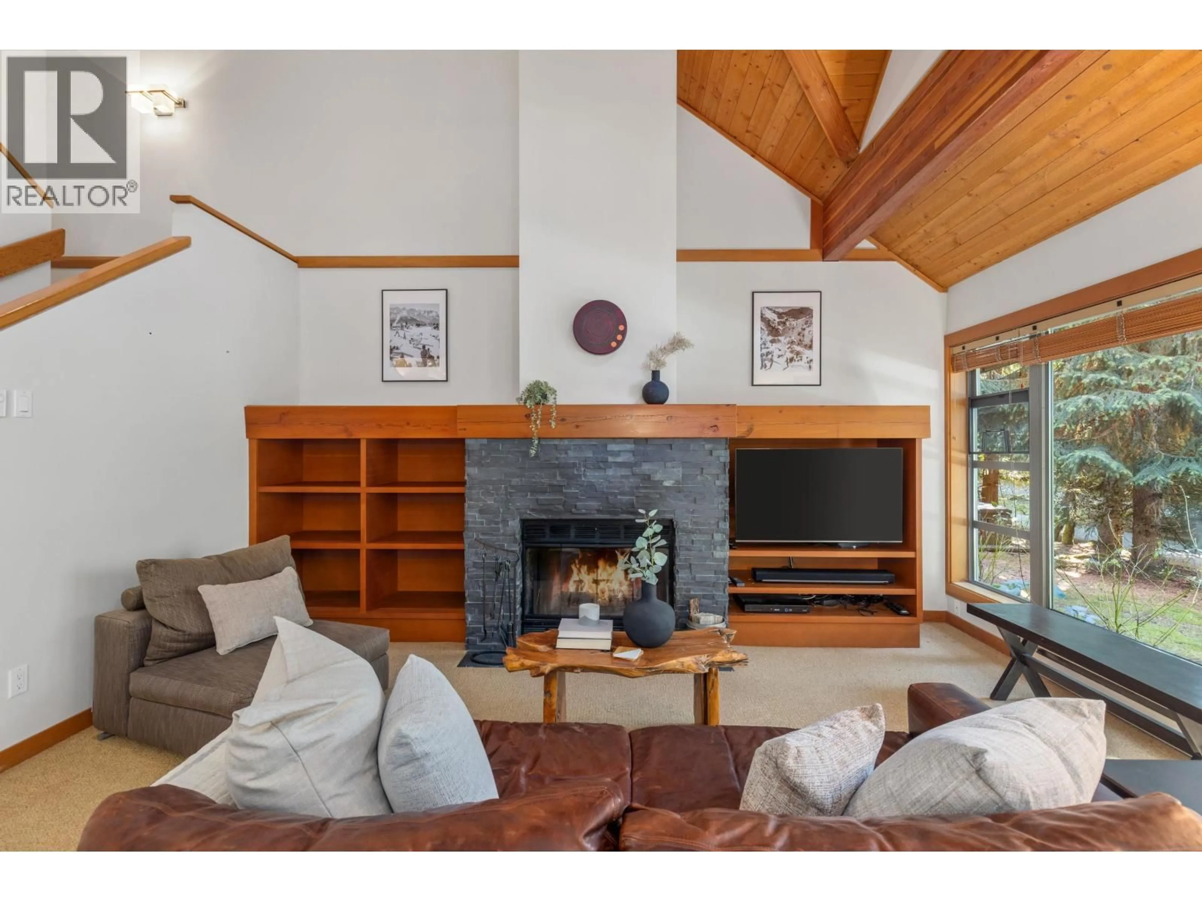 Living room with furniture, wood/laminate floor for 4603 MONTEBELLO PLACE, Whistler British Columbia V8E0Z4