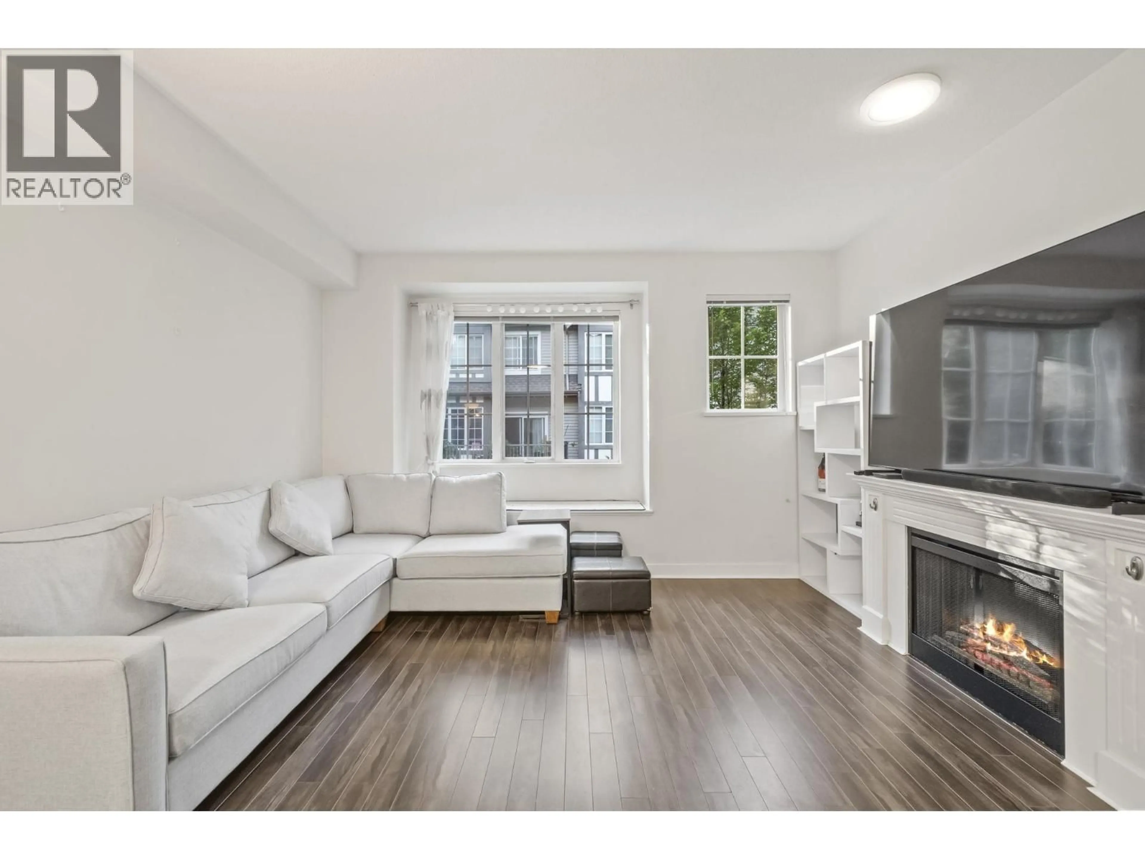 Living room with furniture, wood/laminate floor for 30 - 8533 CUMBERLAND PLACE, Burnaby British Columbia V3N5C1