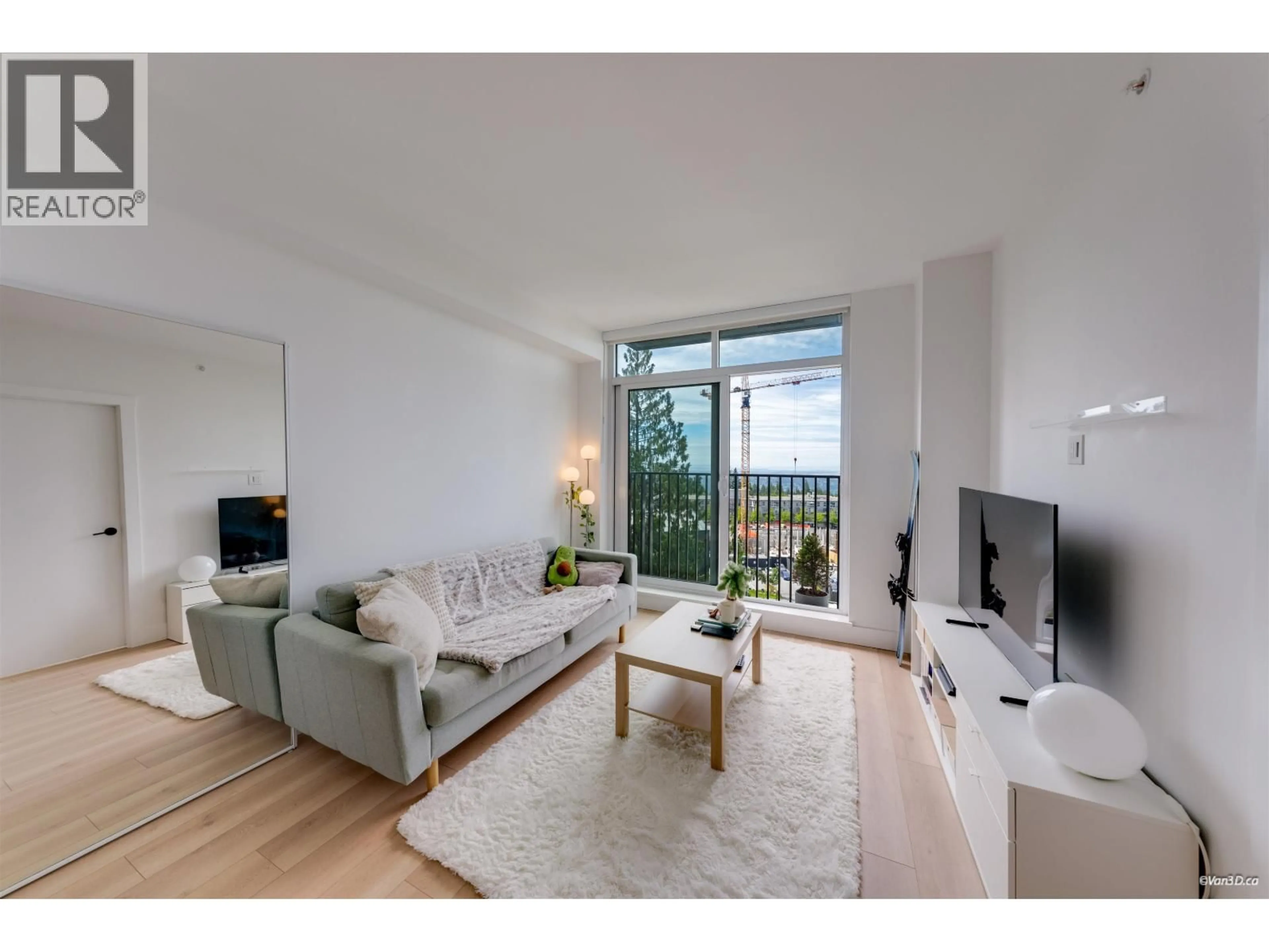 Living room with furniture, wood/laminate floor for 1001 - 8750 UNIVERSITY CRESCENT, Burnaby British Columbia V5A0G9