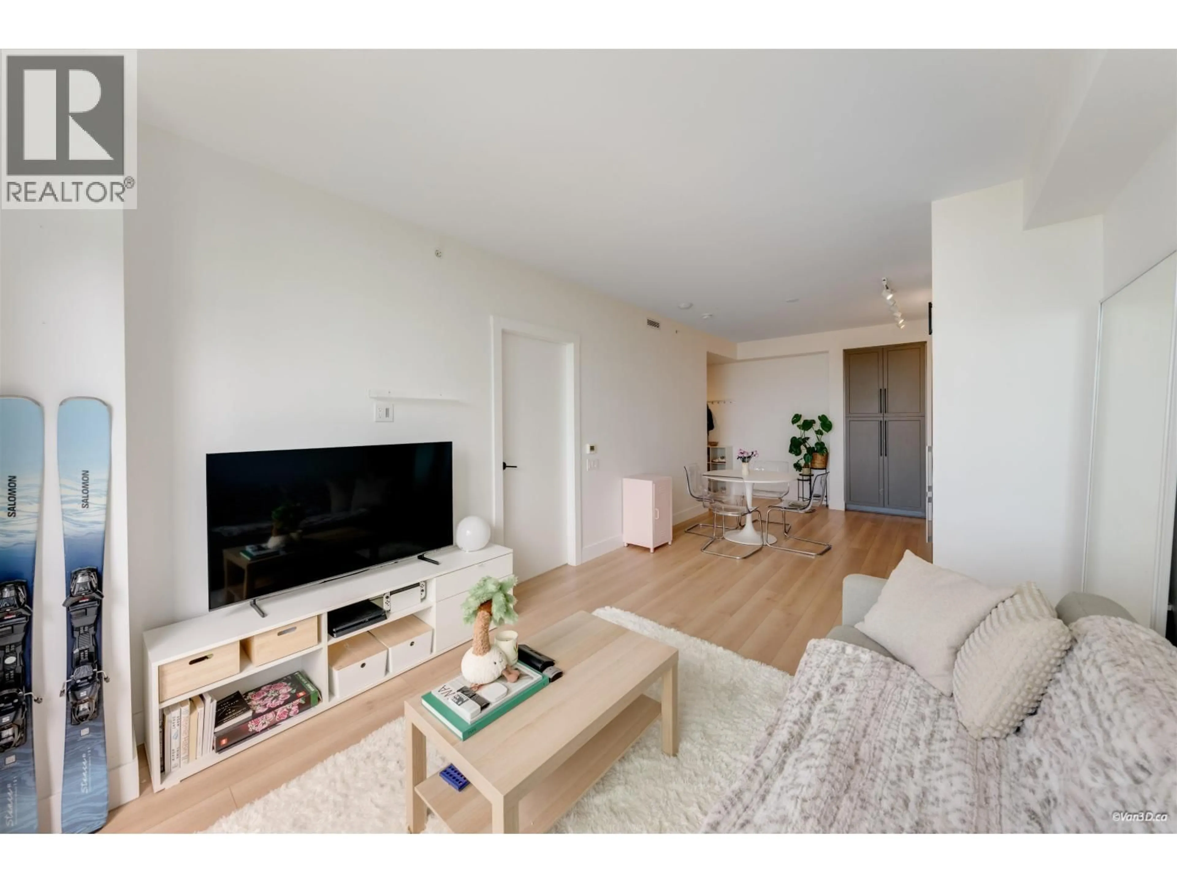 Living room with furniture, wood/laminate floor for 1001 - 8750 UNIVERSITY CRESCENT, Burnaby British Columbia V5A0G9