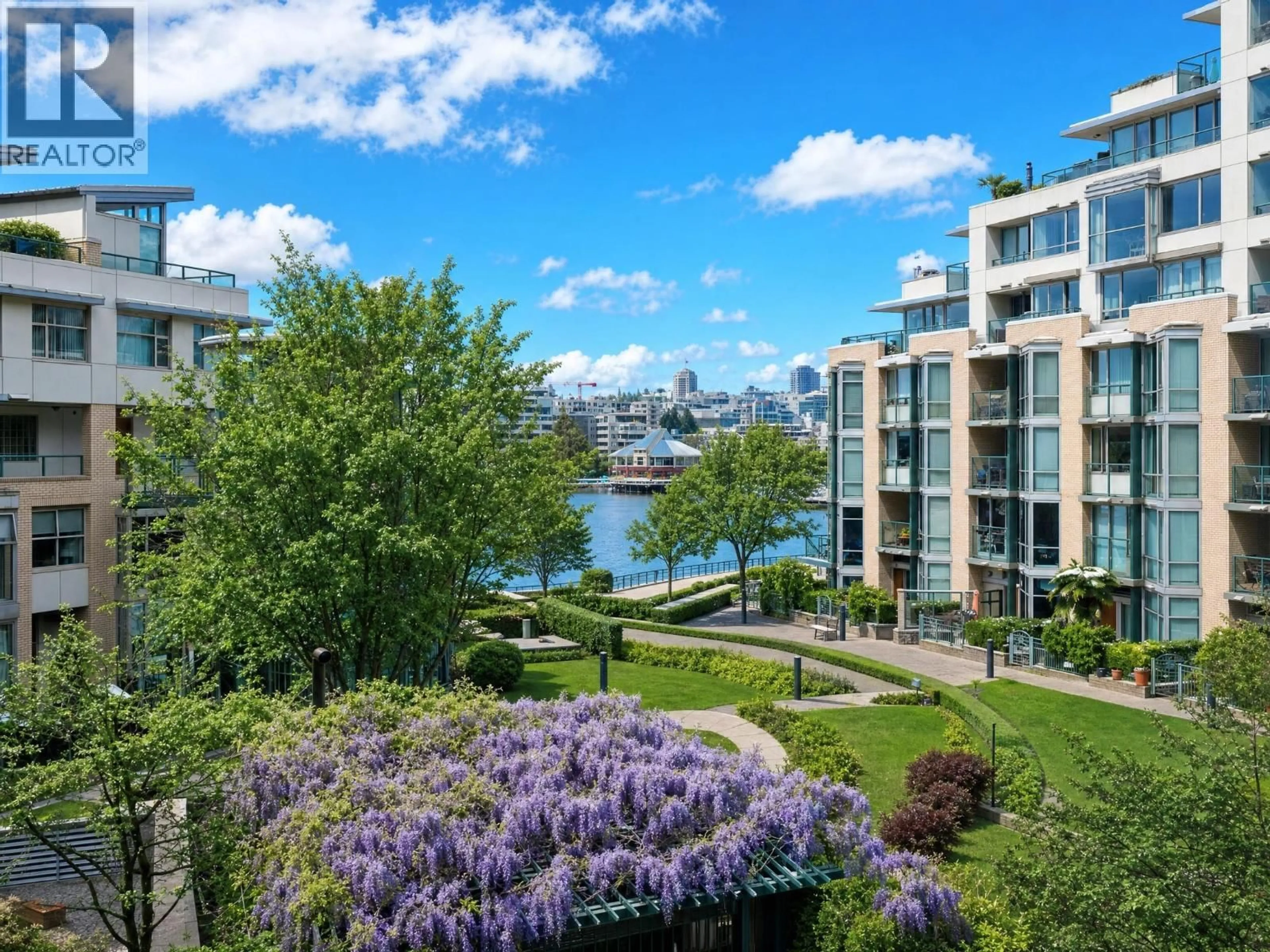 A pic from outside/outdoor area/front of a property/back of a property/a pic from drone, water/lake/river/ocean view for 302 - 1228 MARINASIDE CRESCENT, Vancouver British Columbia V6Z2W4