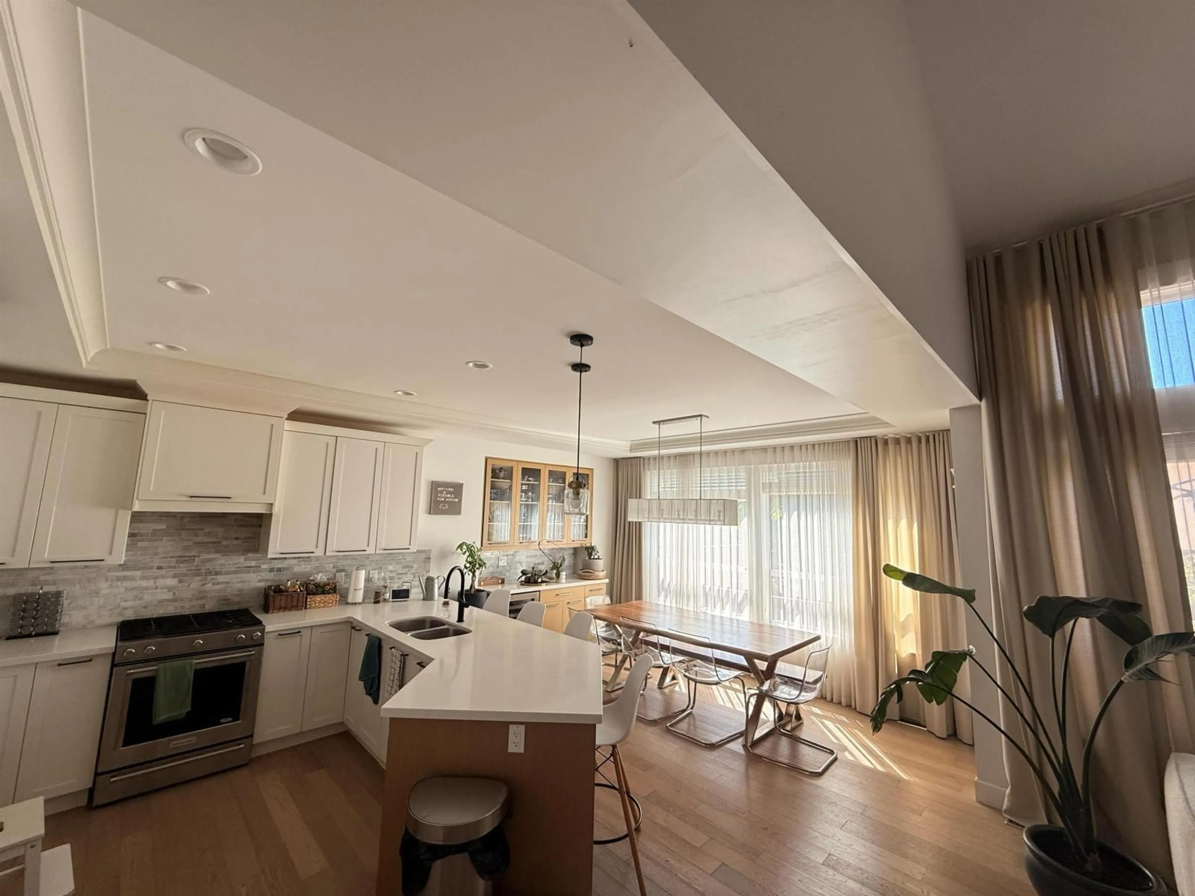 Open concept kitchen, wood/laminate floor for 8467 206 STREET, Langley British Columbia V2Y0P7