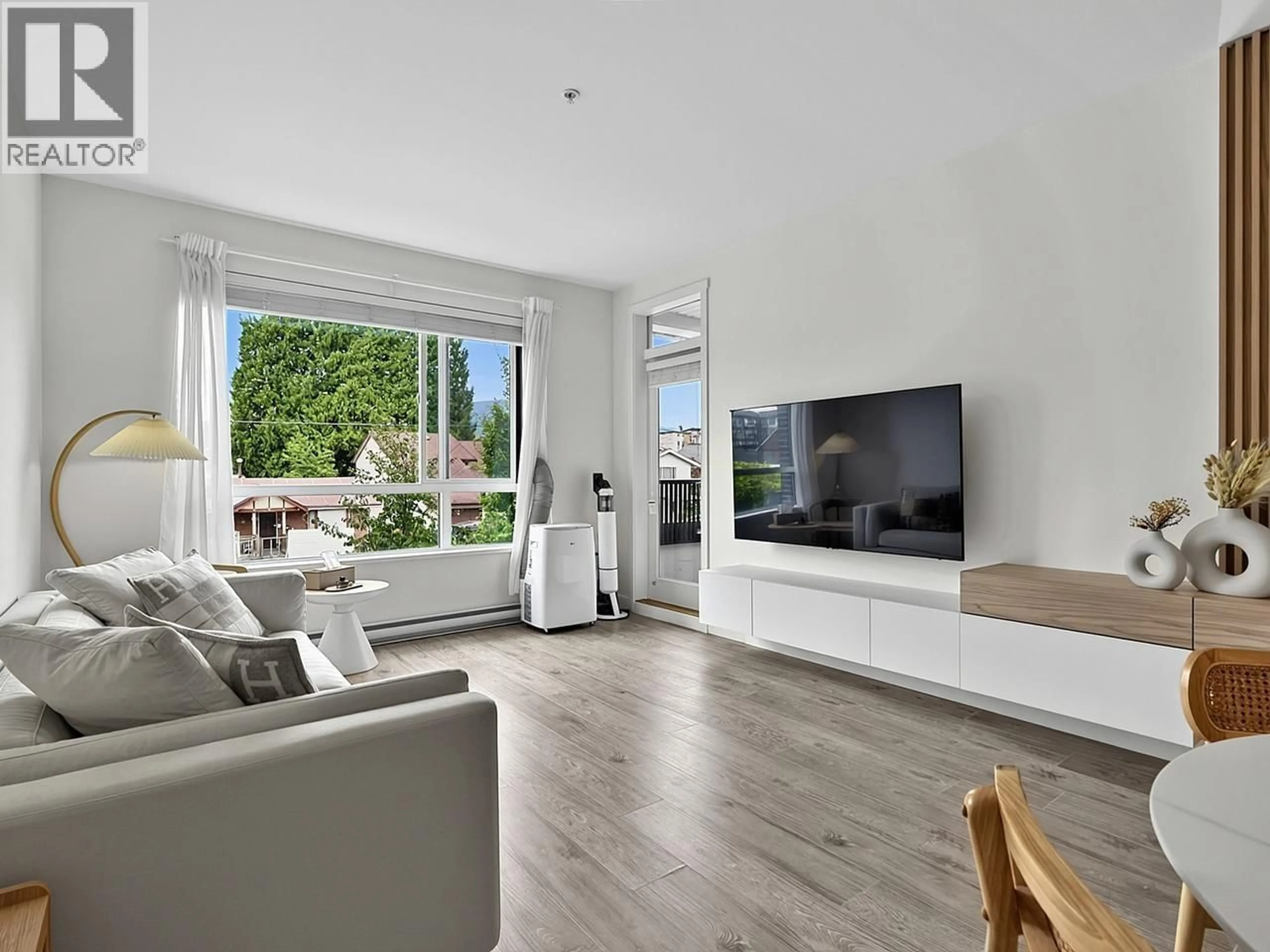 Living room with furniture, wood/laminate floor for 201 - 2160 GRANT AVENUE, Port Coquitlam British Columbia V3B0T3
