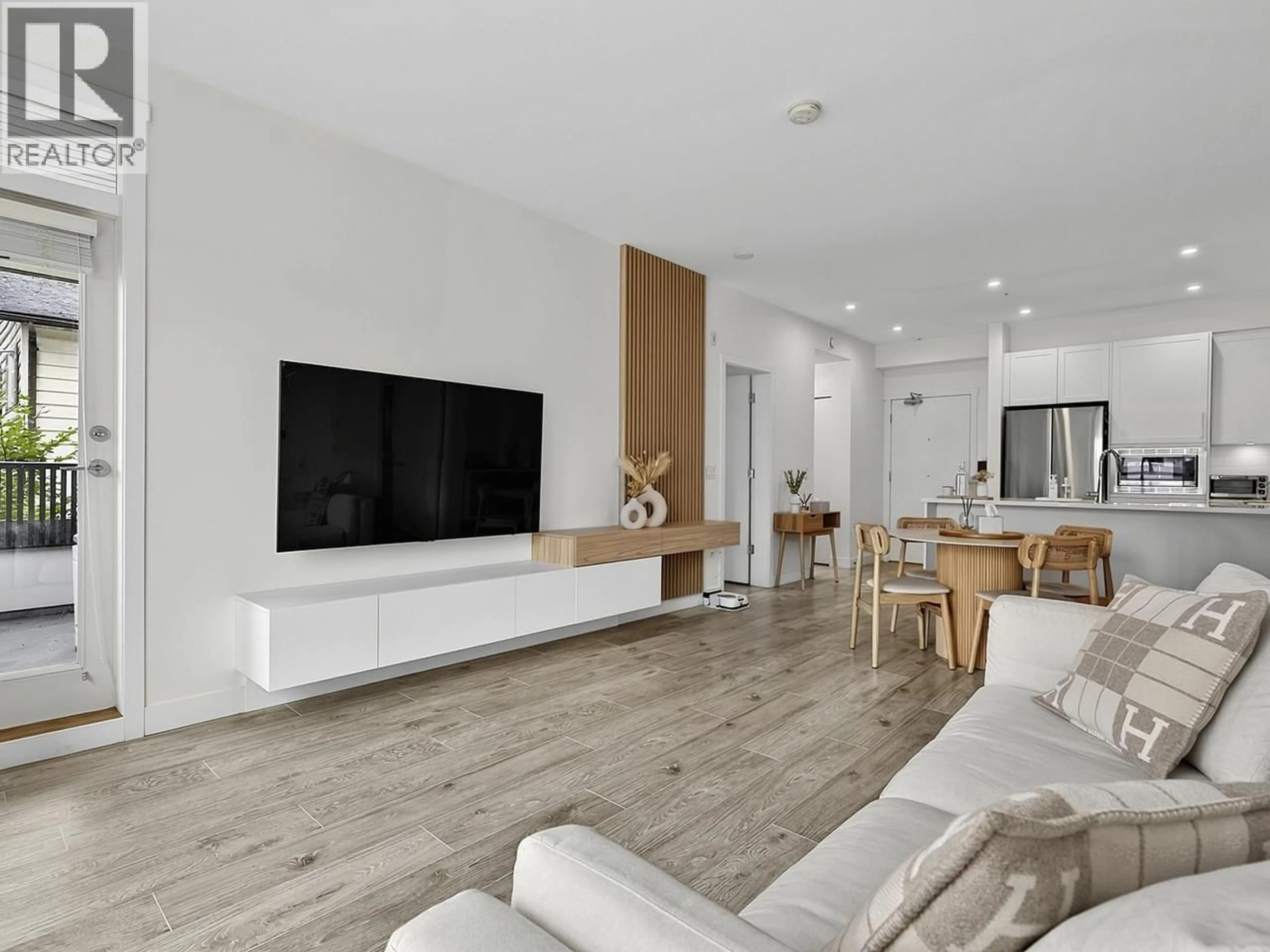Living room with furniture, wood/laminate floor for 201 - 2160 GRANT AVENUE, Port Coquitlam British Columbia V3B0T3