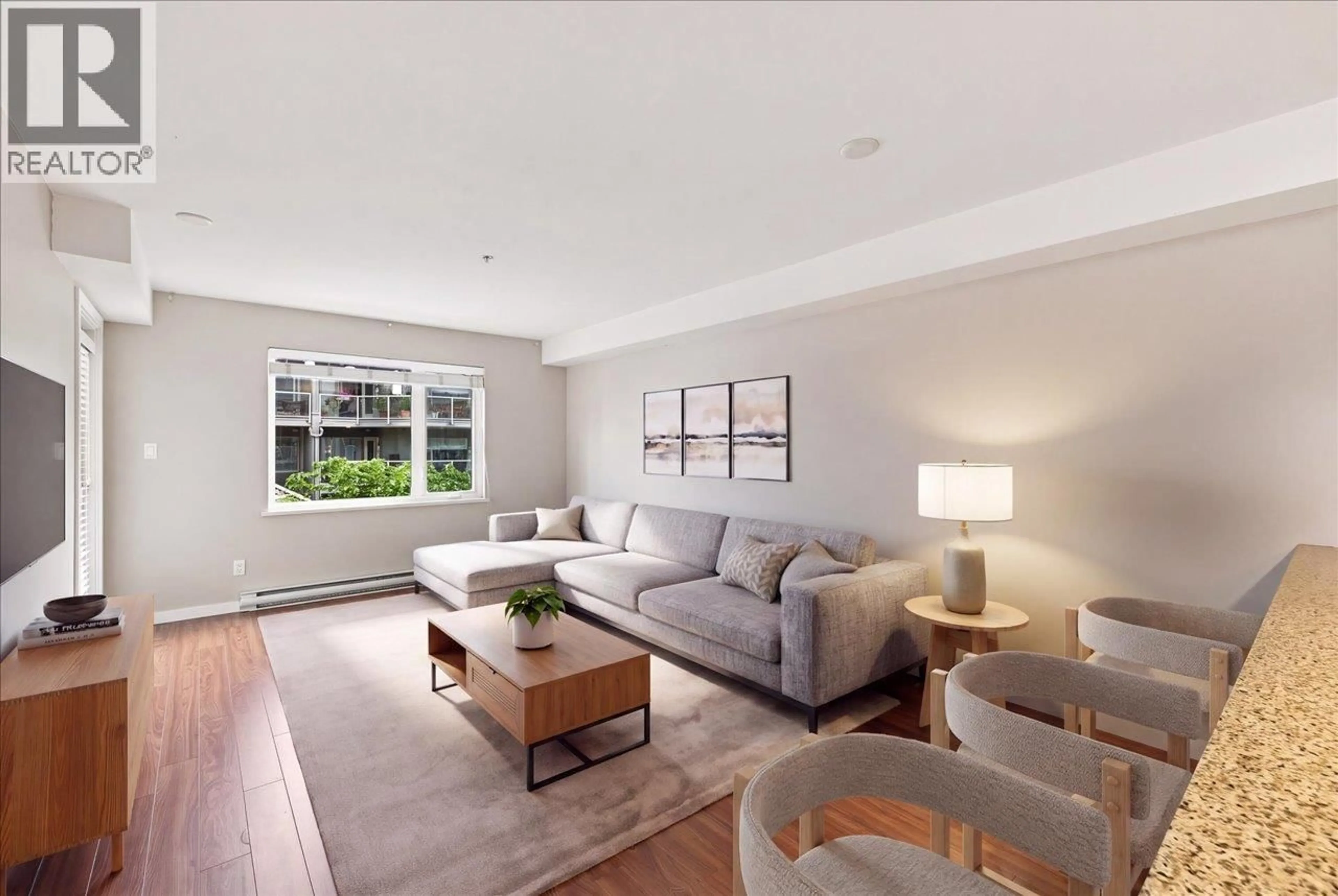 Living room with furniture, wood/laminate floor for 205 - 2373 ATKINS AVENUE, Port Coquitlam British Columbia V3C1Y7