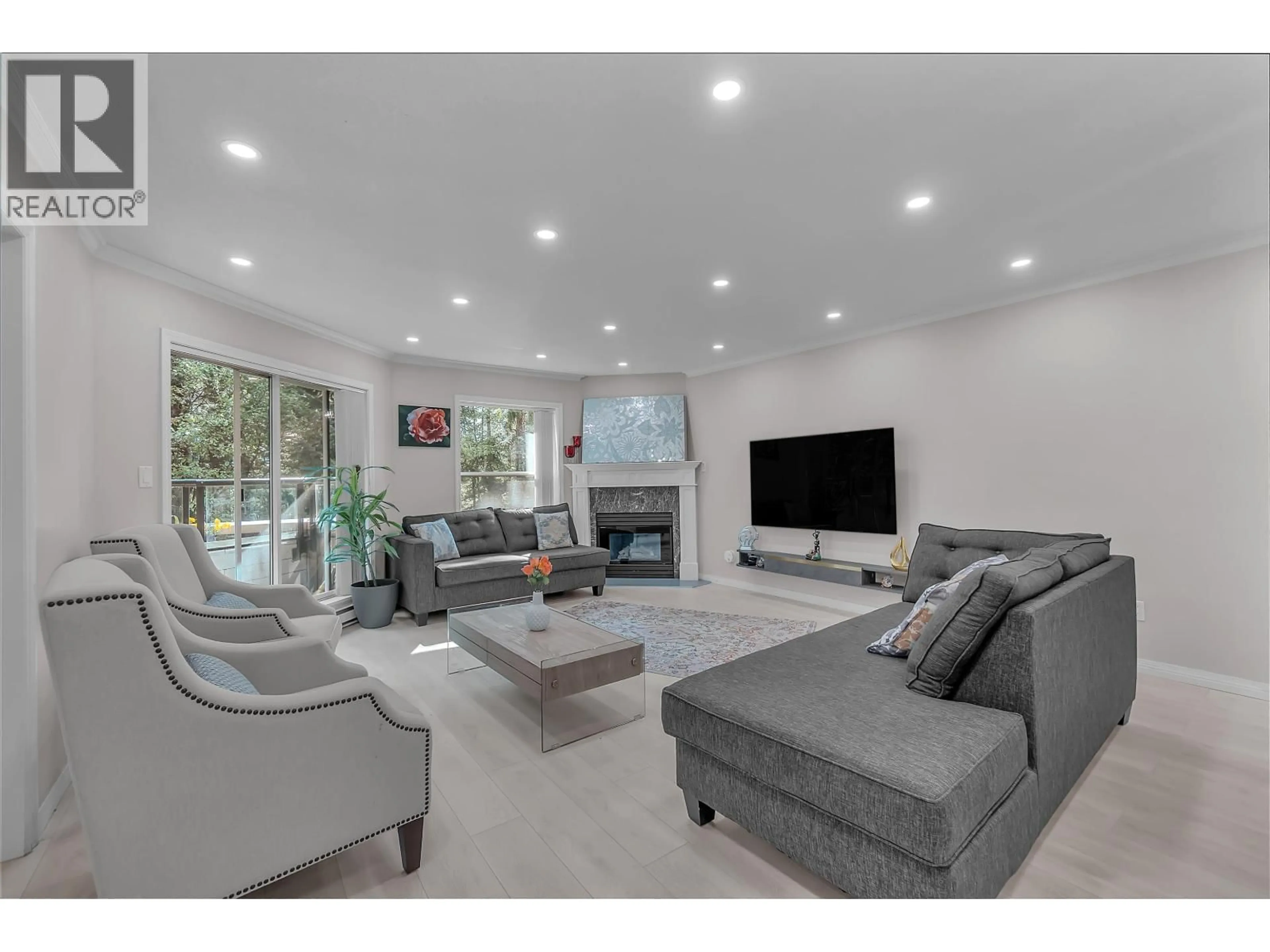 Living room with furniture, unknown for 207 - 1500 OSTLER COURT, North Vancouver British Columbia V7G2S2
