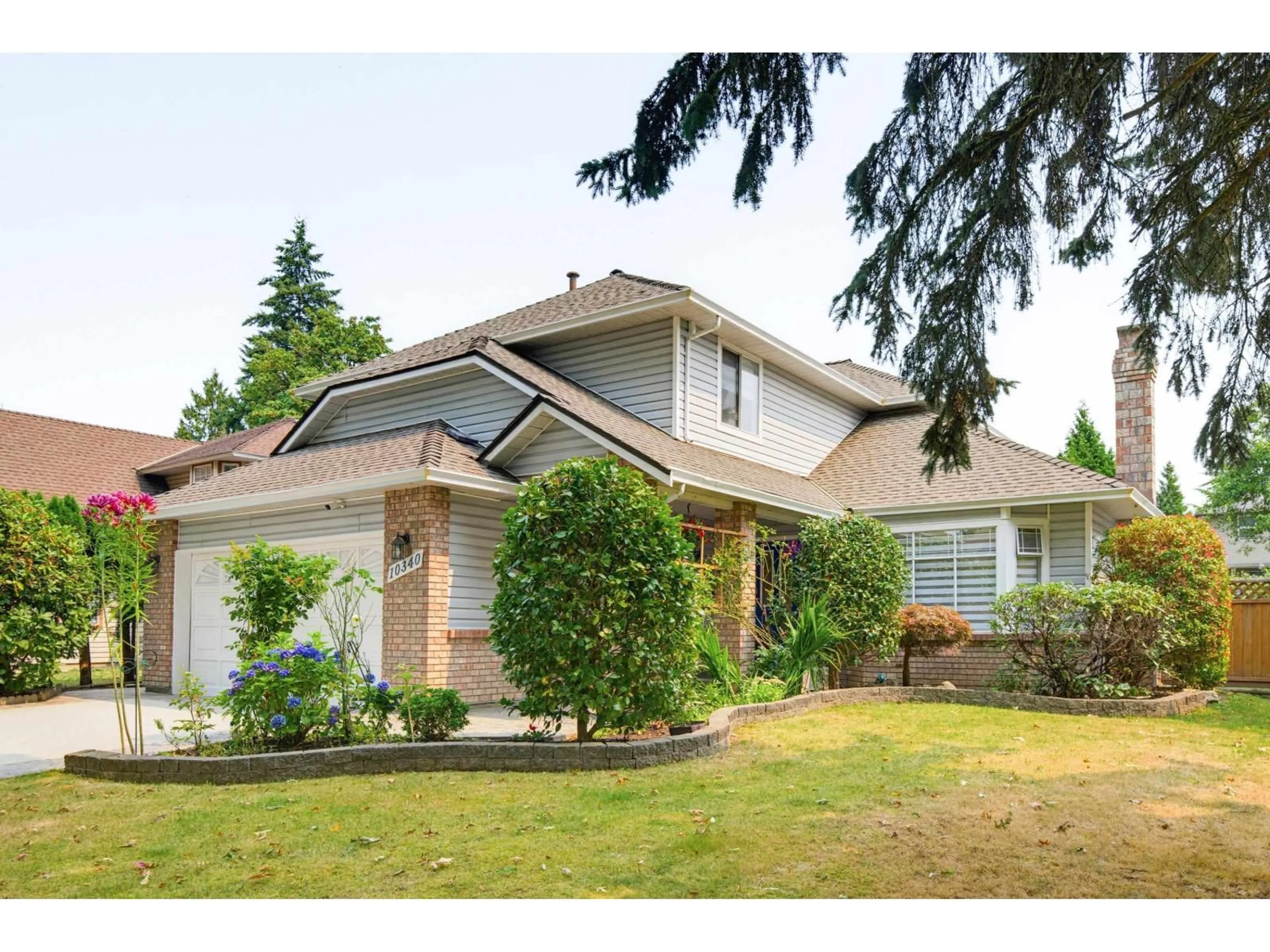 Home with vinyl exterior material, street for 10340 167 STREET, Surrey British Columbia V4N1Z2