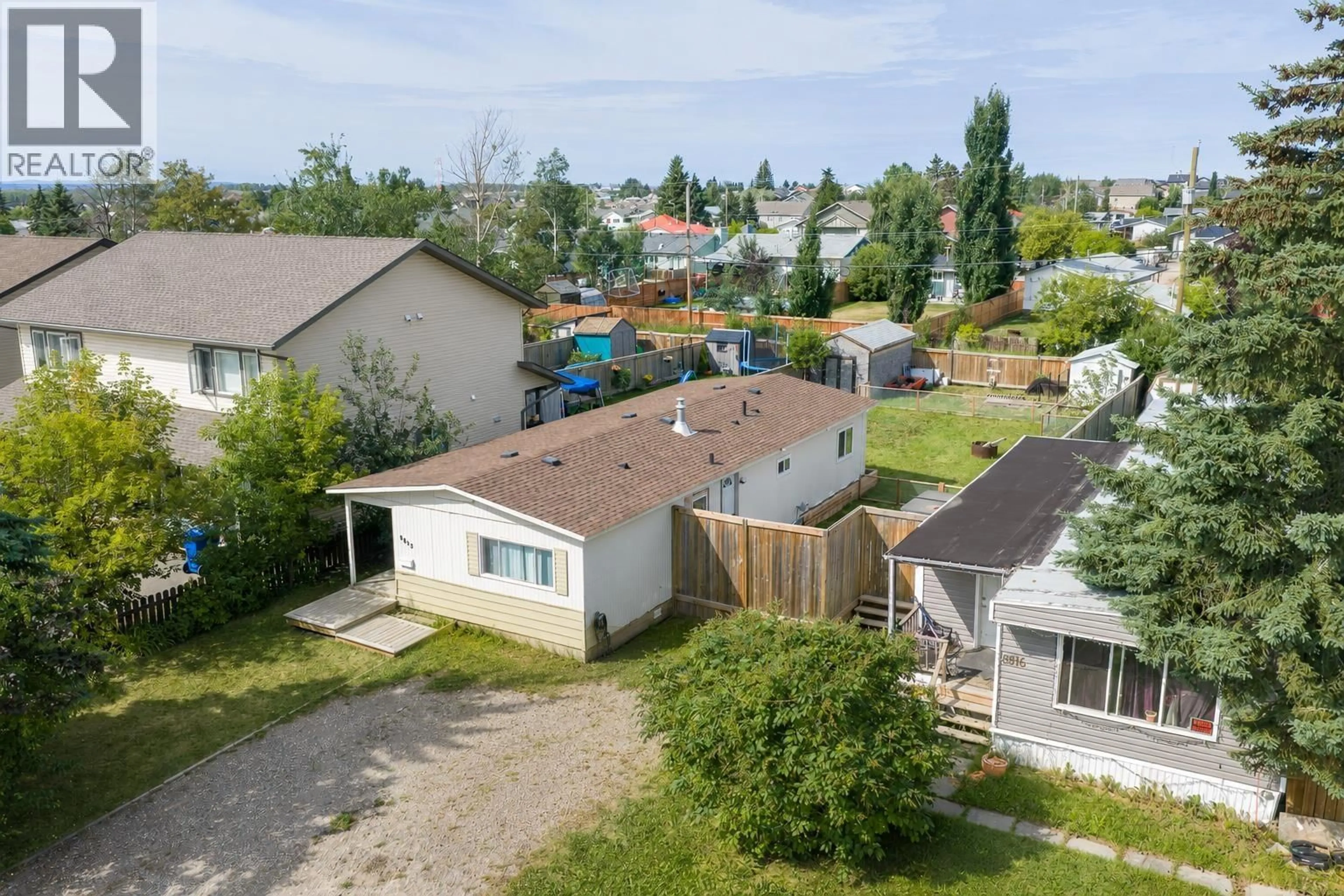 A pic from outside/outdoor area/front of a property/back of a property/a pic from drone, street for 8812 76 STREET, Fort St. John British Columbia V1J2Z6