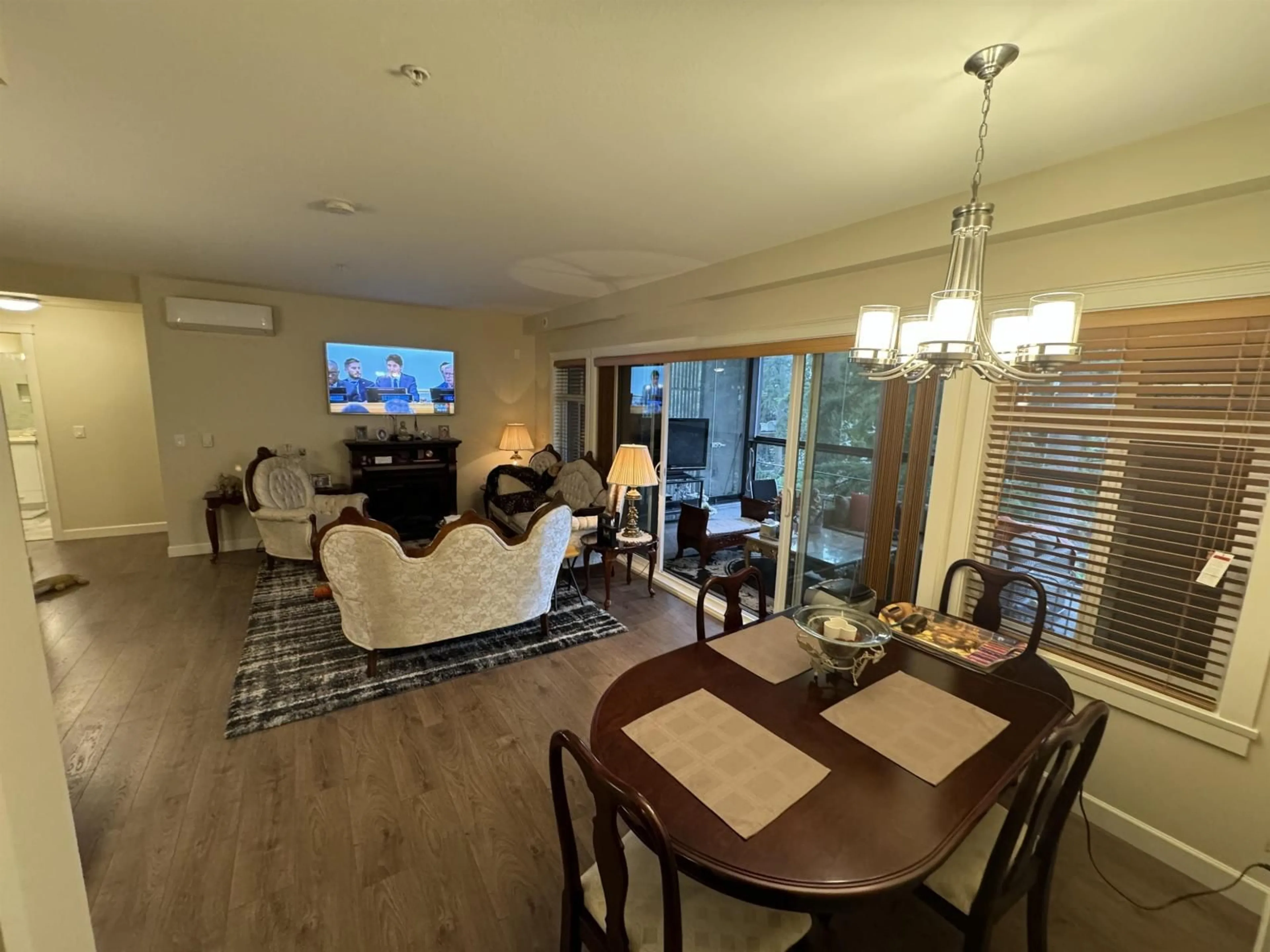 Living room with furniture, wood/laminate floor for 409 - 3535 146A STREET, Surrey British Columbia V4P0H2