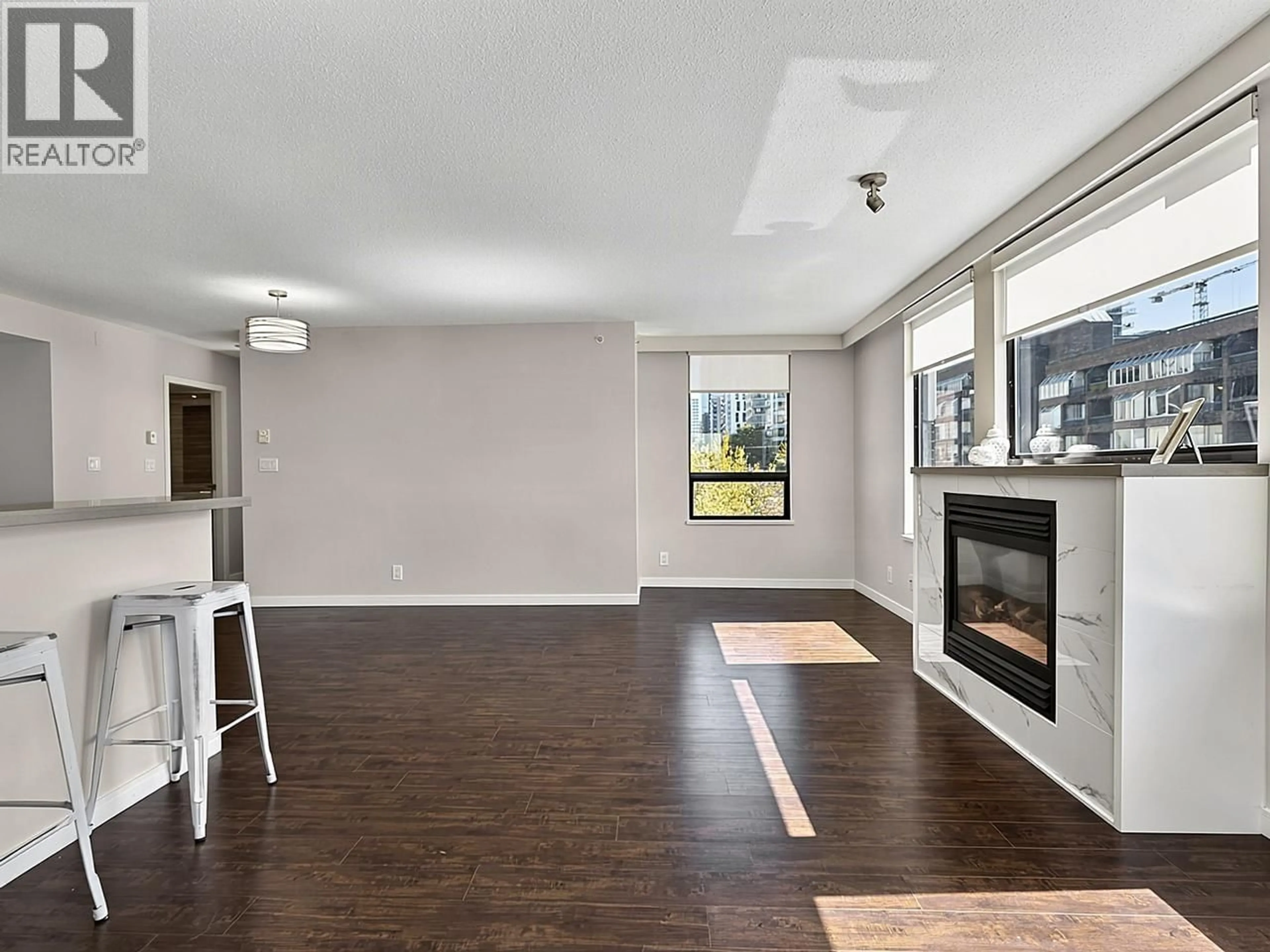 Living room with furniture, wood/laminate floor for 601 - 1003 PACIFIC STREET, Vancouver British Columbia V6E4P2
